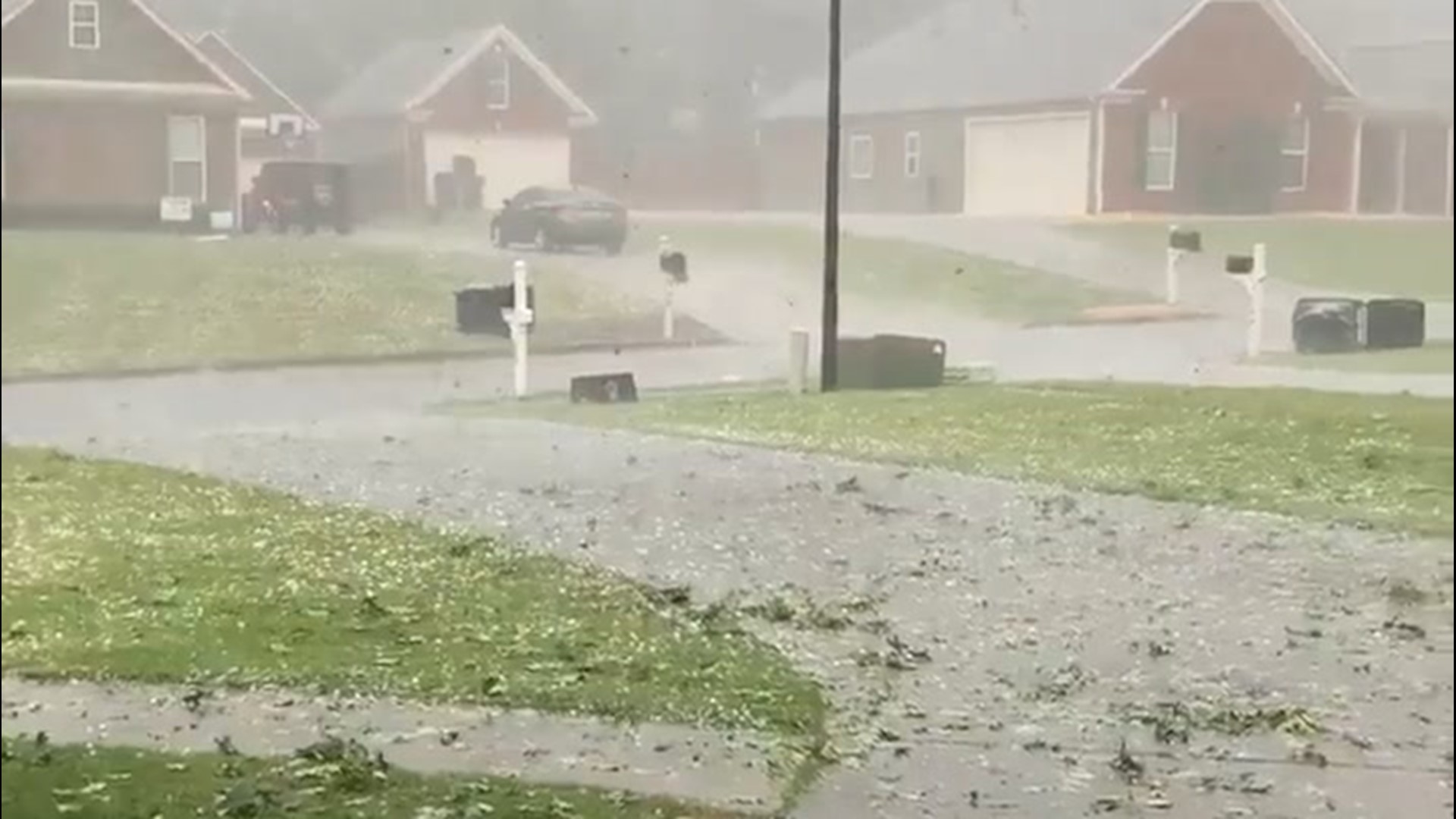 Hail, gusty winds blow through