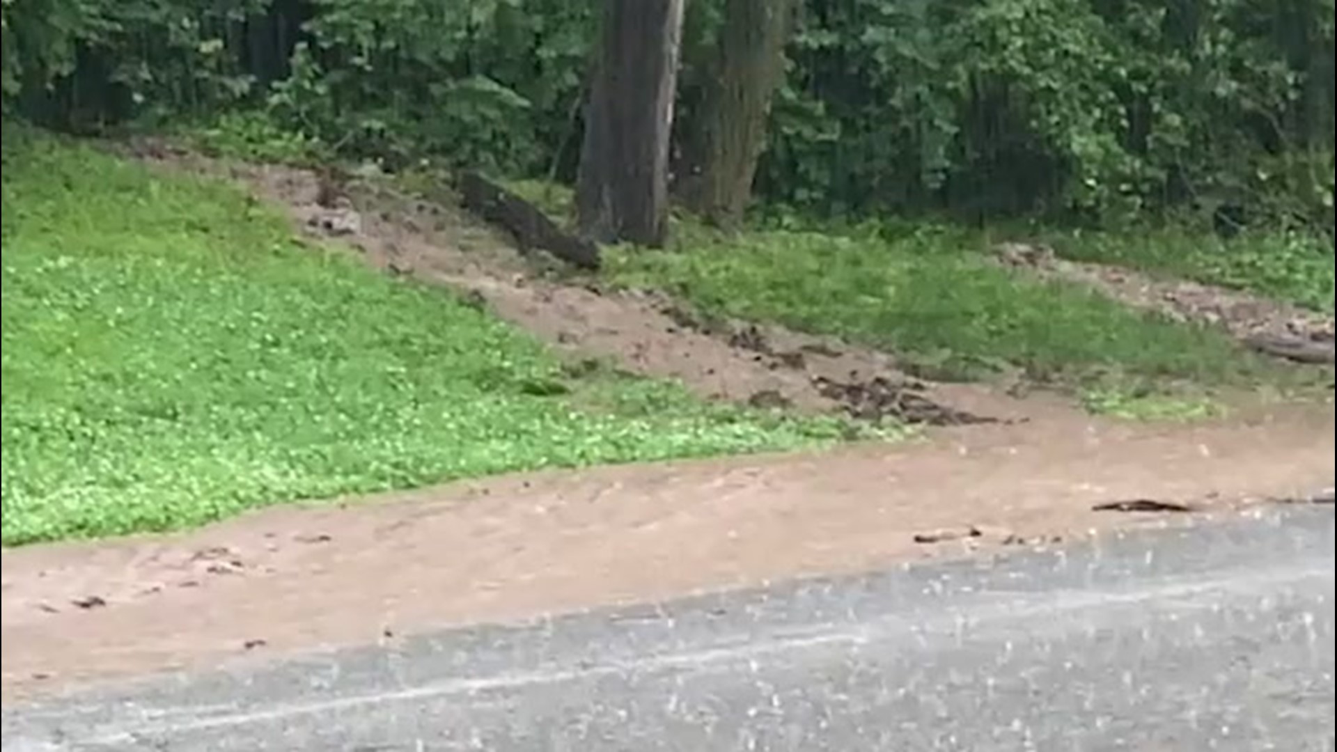 A rainstorm inundated the streets of Kansas City, Missouri, with floodwaters. Strong mudflows, like this one on video, spilled onto numerous roads on May 28.