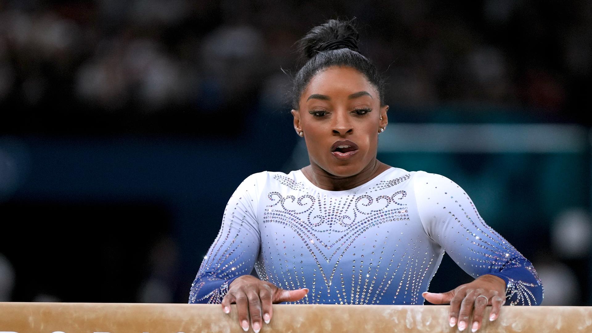 Simone Biles falls off balance beam