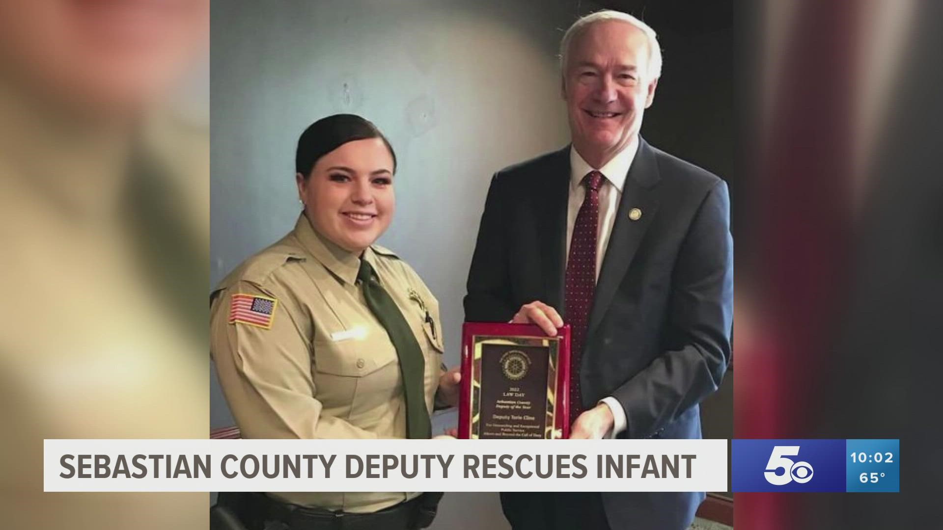 Deputy Tori Cline was honored by Governor Hutchinson for saving an infant who had been choking and unresponsive.