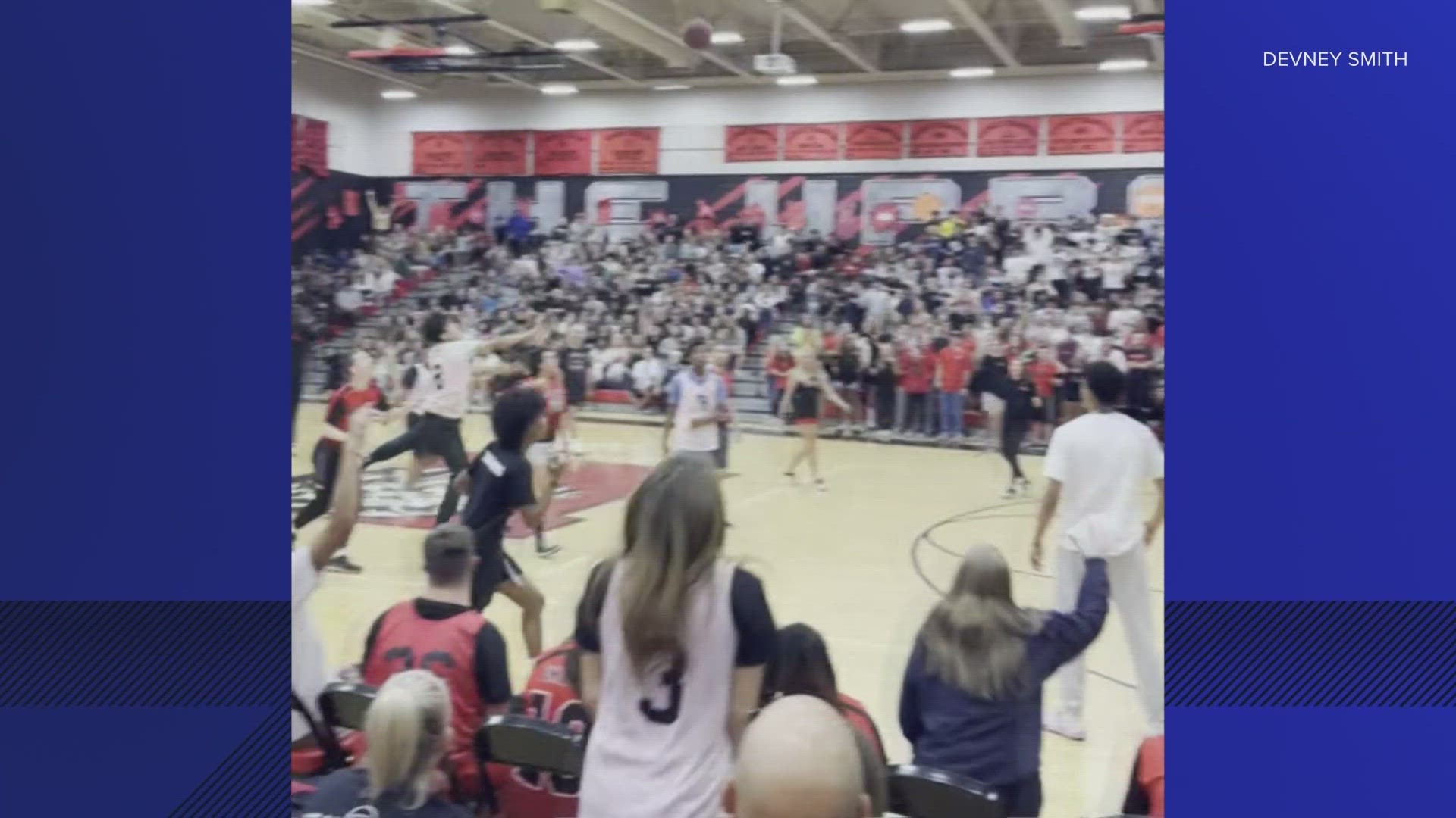 The student was surrounded and cheered on by students after sinking the buzzer-beater.