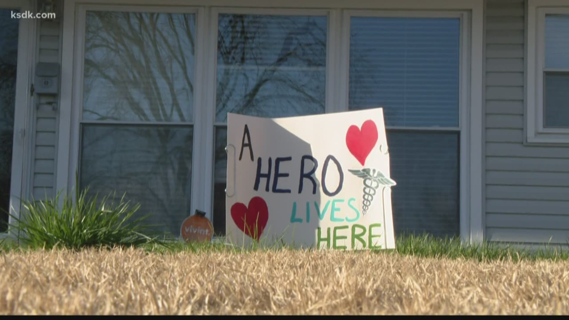 It can be hard to tell what your neighbors do for a living, but one hospital worker is making sure people know where the heroes live