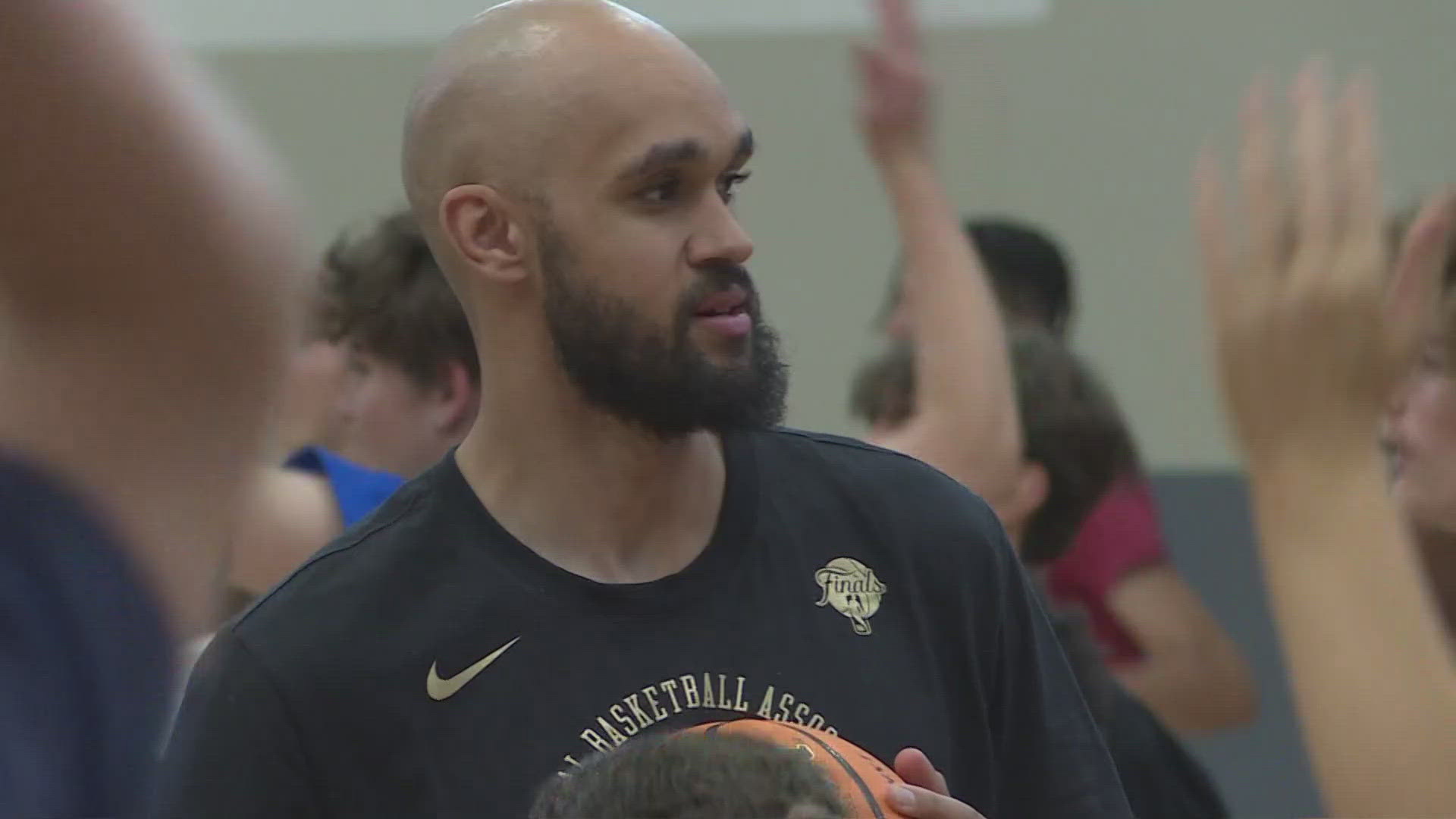 The local hoops star, who just became an NBA Champion, is back in his hometown of Parker giving back to young kids.