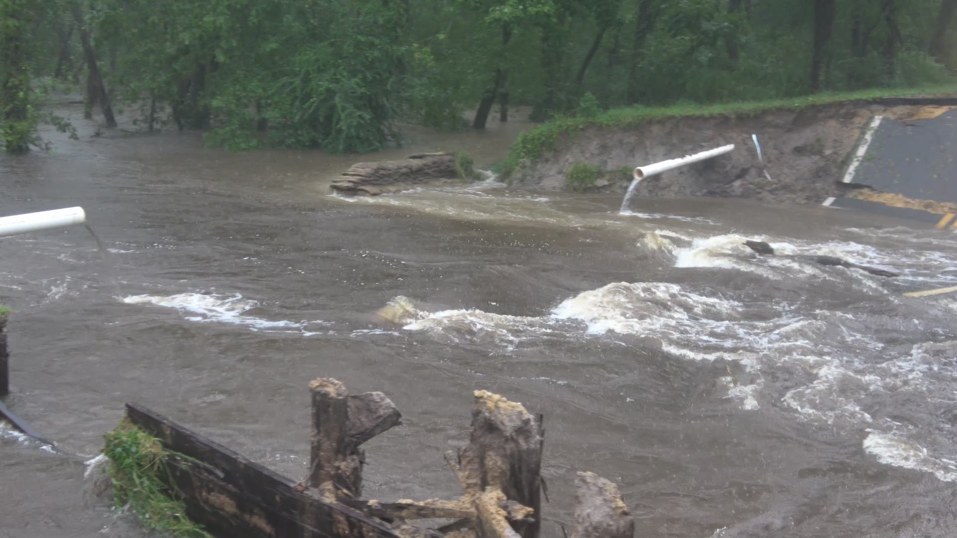 Dramatic footage shows raging flood waters washing out a road in Mt. Olive, North Carolina. Video: LSM Brandon Clement/Brett Adair