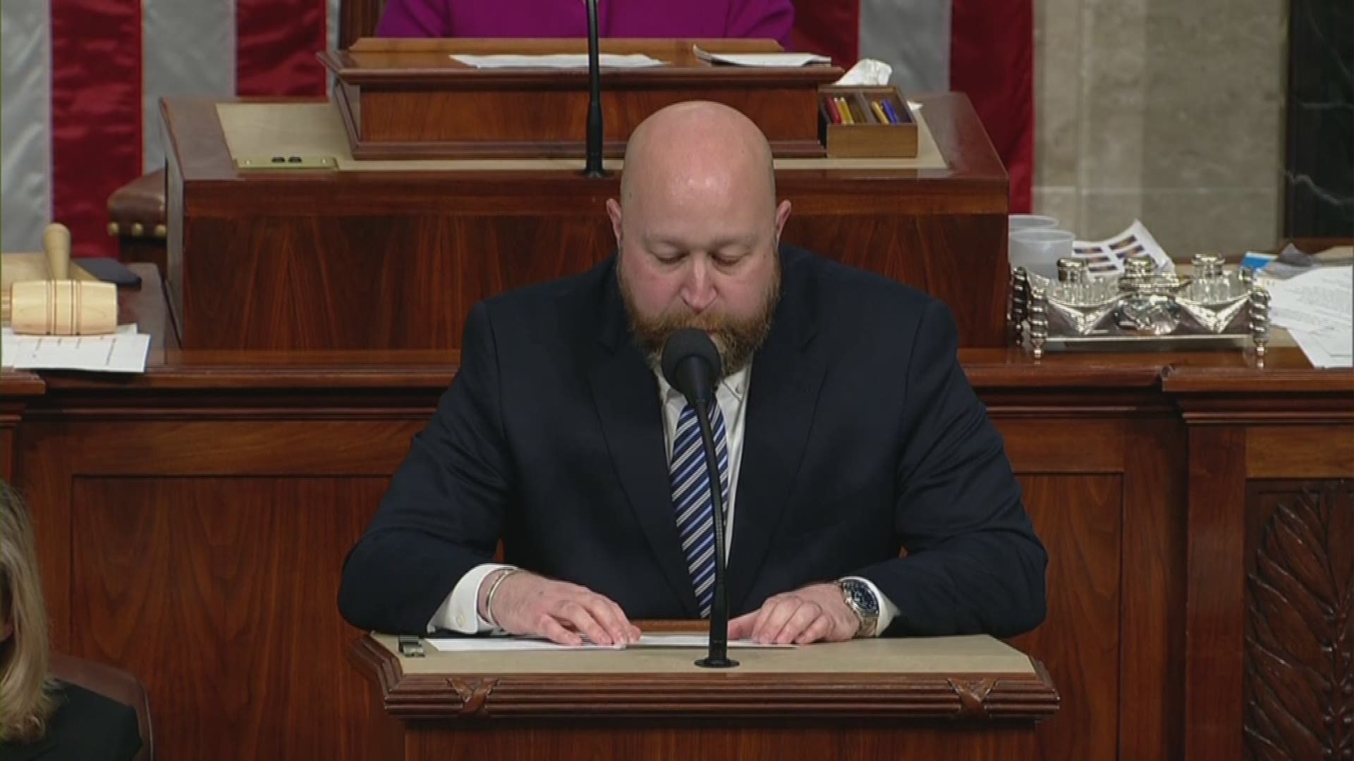 A House clerk reads out the articles of impeachment against President Trump that will be voted on.