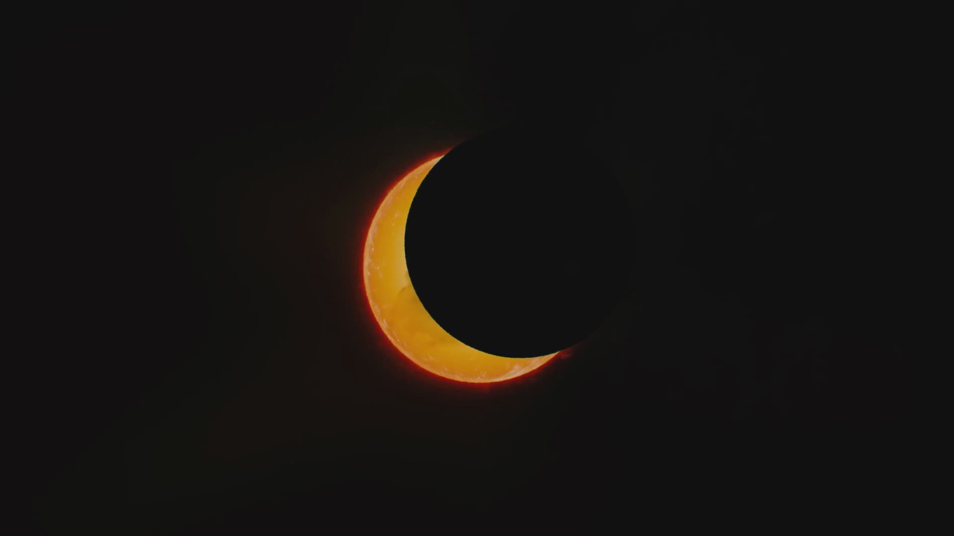 Watch as the moon blocks out the sun during an annular eclipse, "ring of fire"