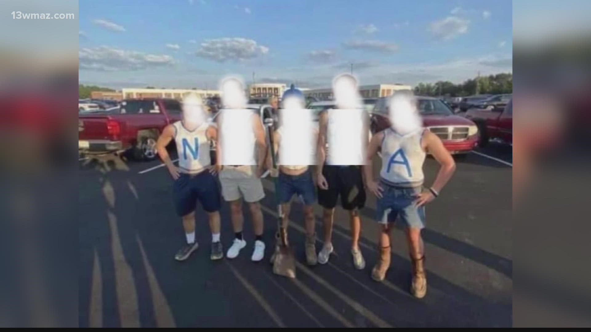 Five white students posted a picture spelling out a racial slur at Friday's West Laurens High School football game, and some people want them to face consequences.