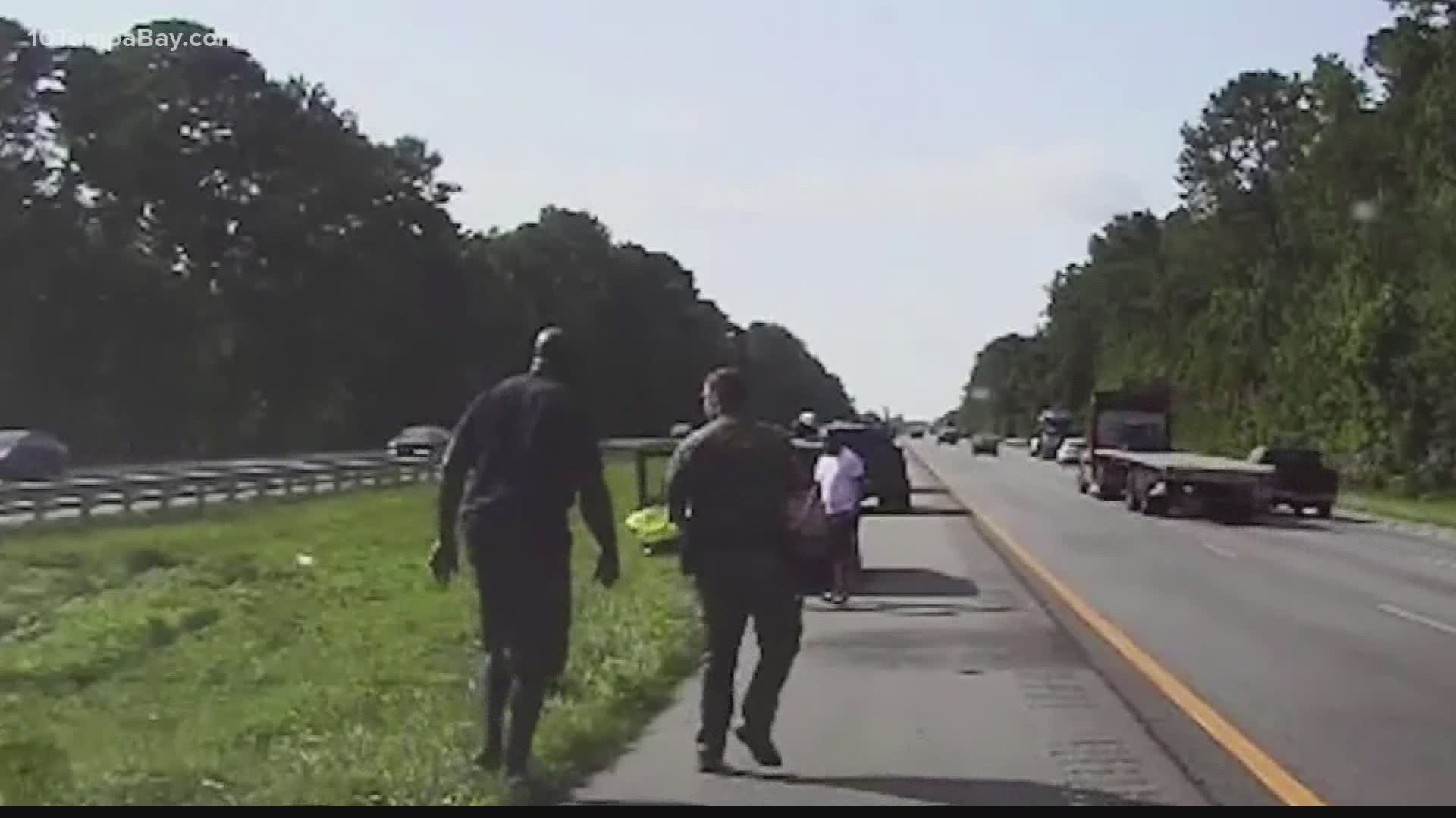 The basketball legend saw a tire blow on a woman's car so he stopped to help her until law enforcement arrived.