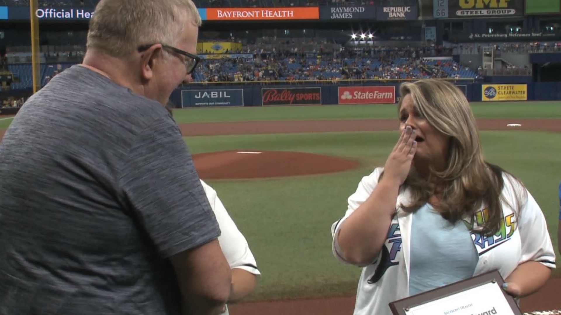 The Tampa Bay Rays took a moment before Friday night's game against the Baltimore Orioles to honor a woman and first responders who helped save a fan's life in June.