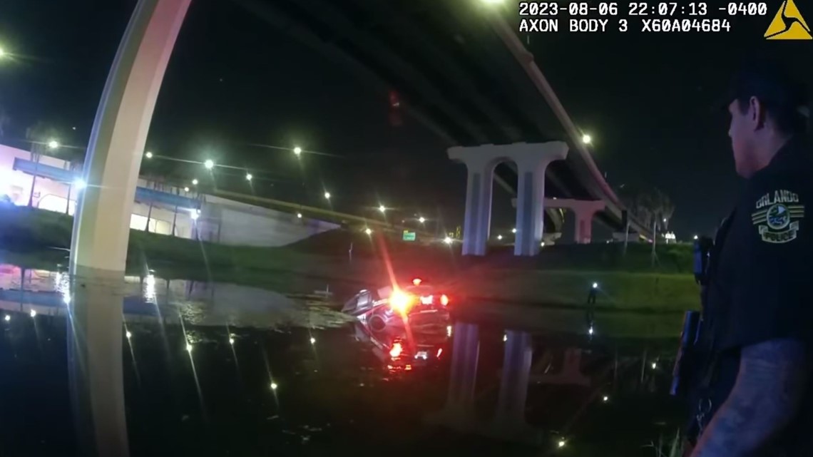 Florida officers rescue driver trapped in car sinking into pond ...