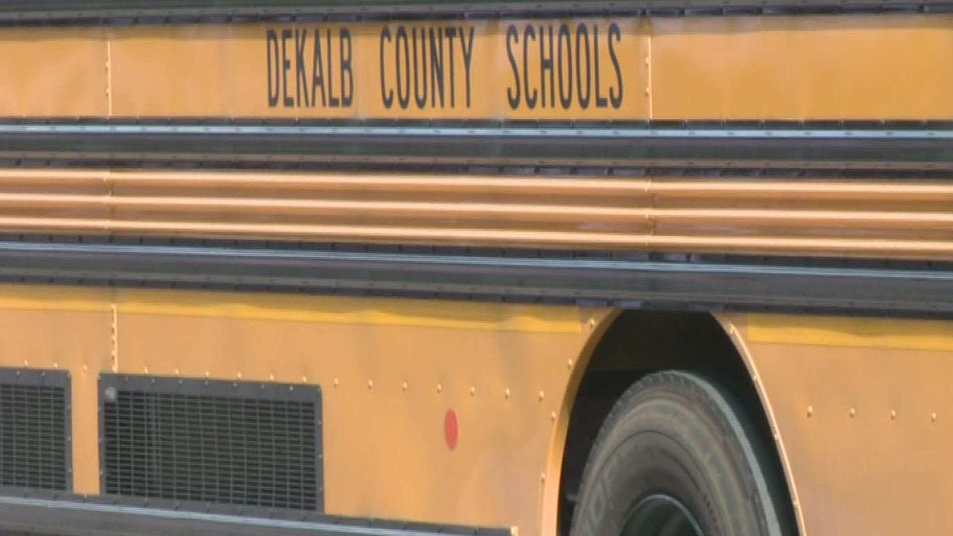 The district says two middle school students, one high school student, and an 18-year-old got on the bus and attacked the students.
