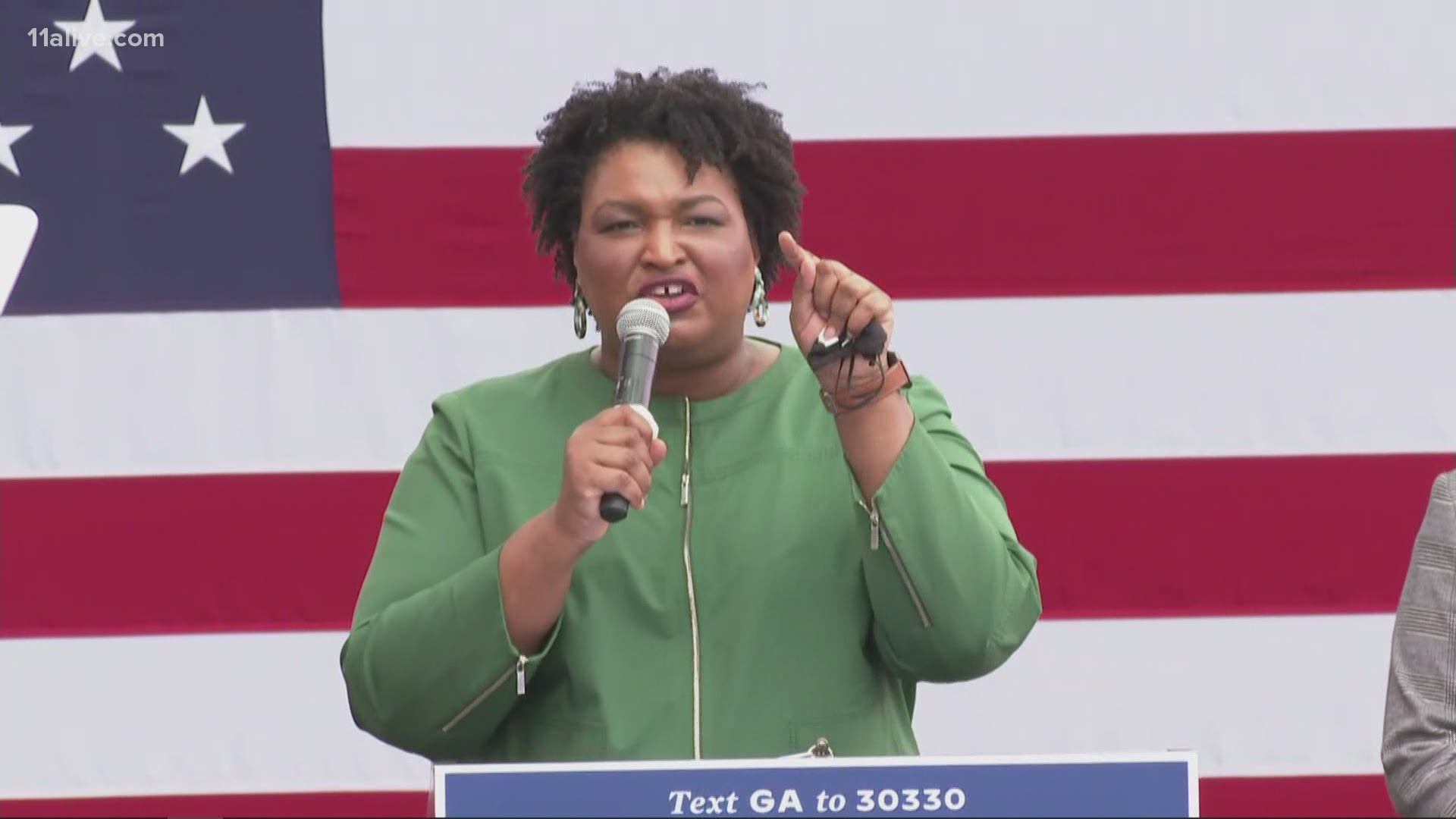 Stacey Abrams addresses the crowd gathered for a early voting rally in DeKalb County.