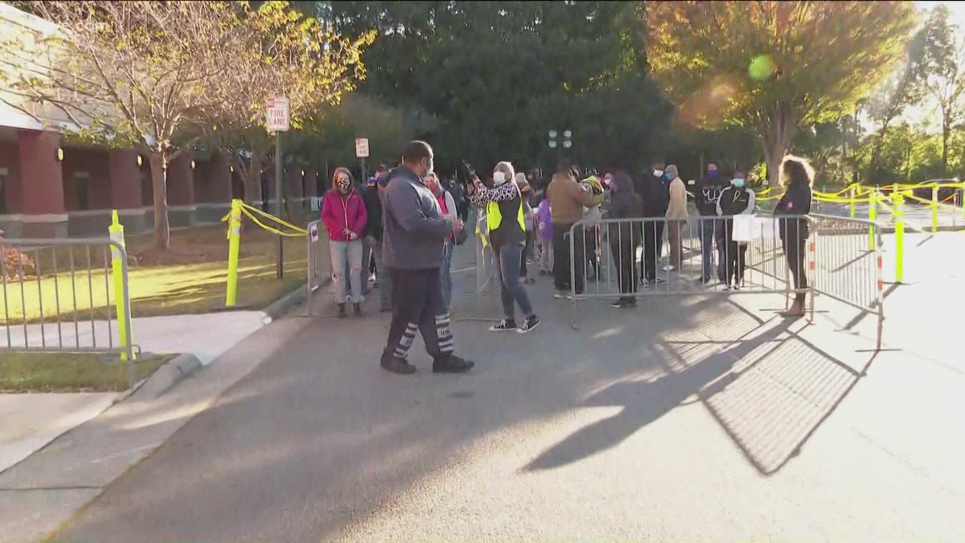 Voters stood in lines that were hours-long early Saturday morning as they waited patiently for early voting in Marietta.