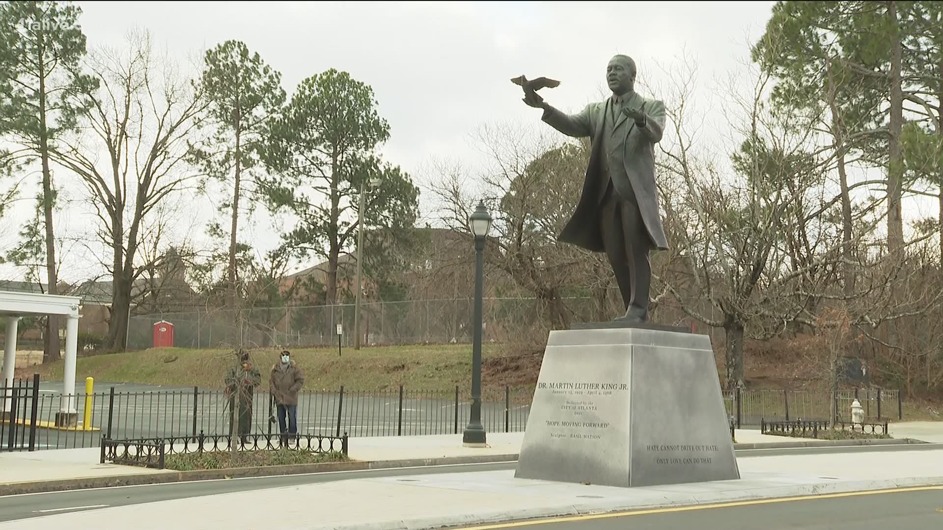 The 12-foot bronze statue stands on a 6-foot granite pedestal inscribed with famous quotes made by the Atlanta pastor and civil rights leader.