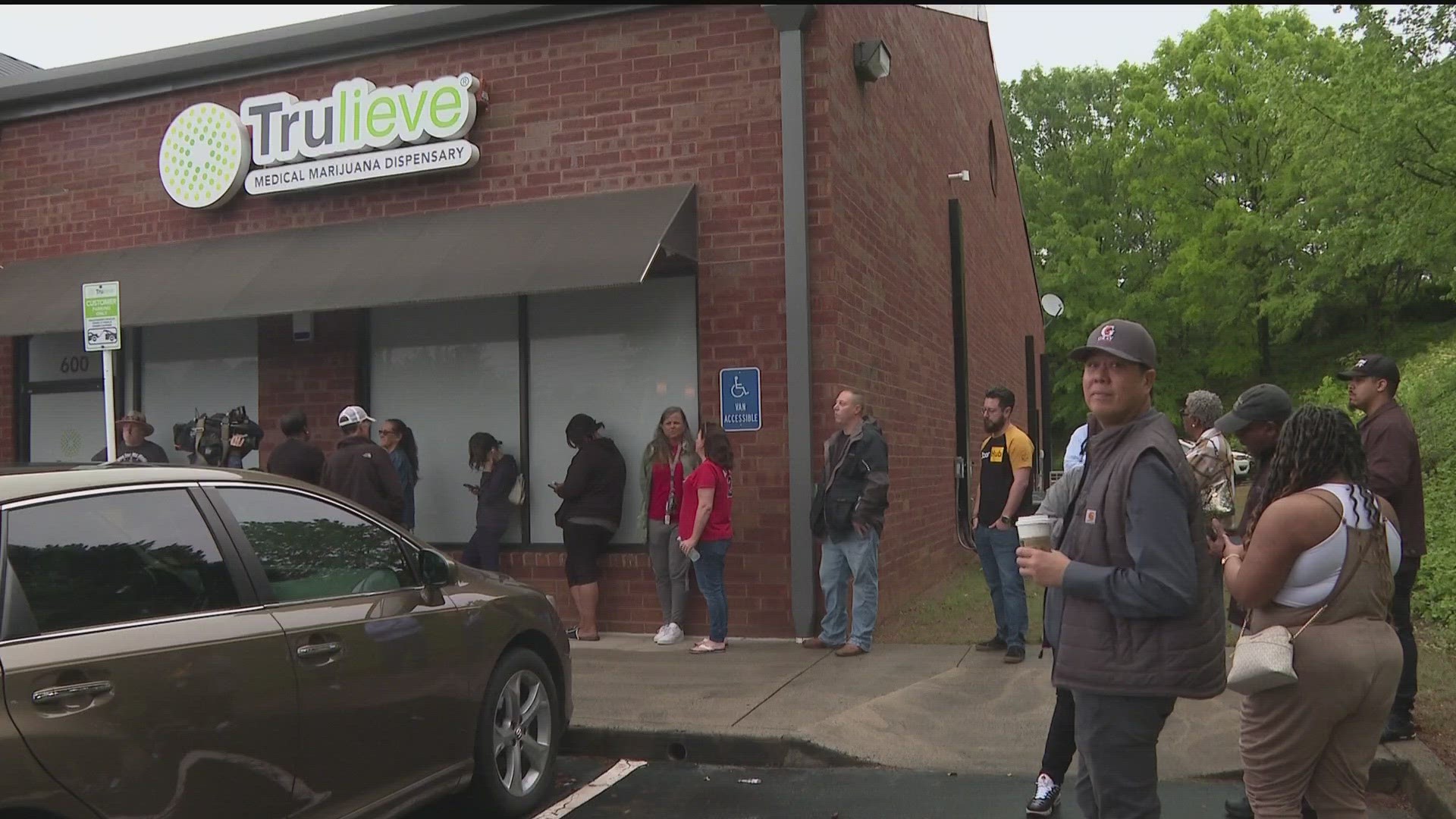 Dozens of people formed a line outside Trulieve in Marietta, set to buy low-THC cannabis products. Another dispensary was opened Friday in Macon.
