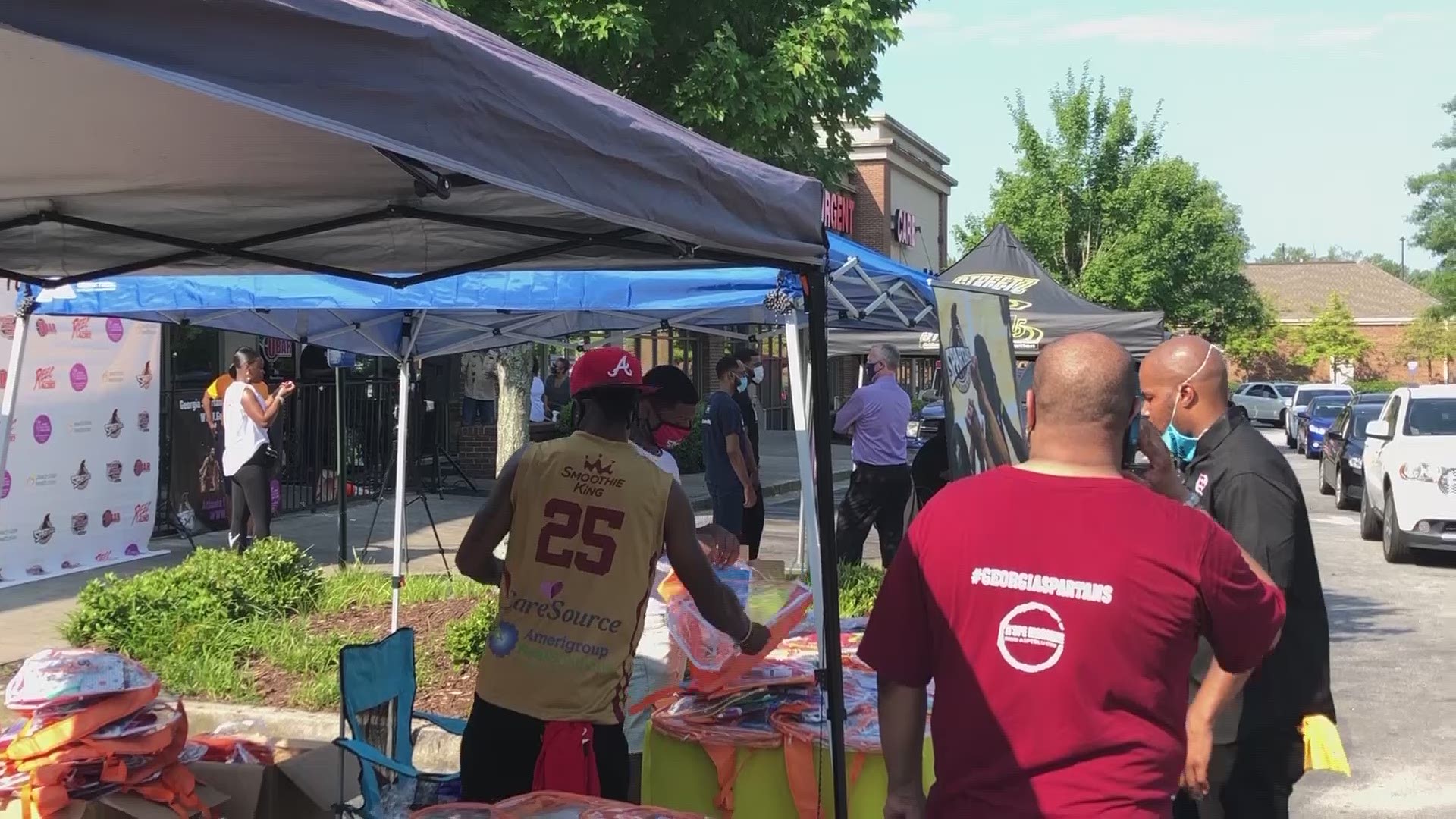 Local sports team hands out supplies to hundreds during back-to-school drive