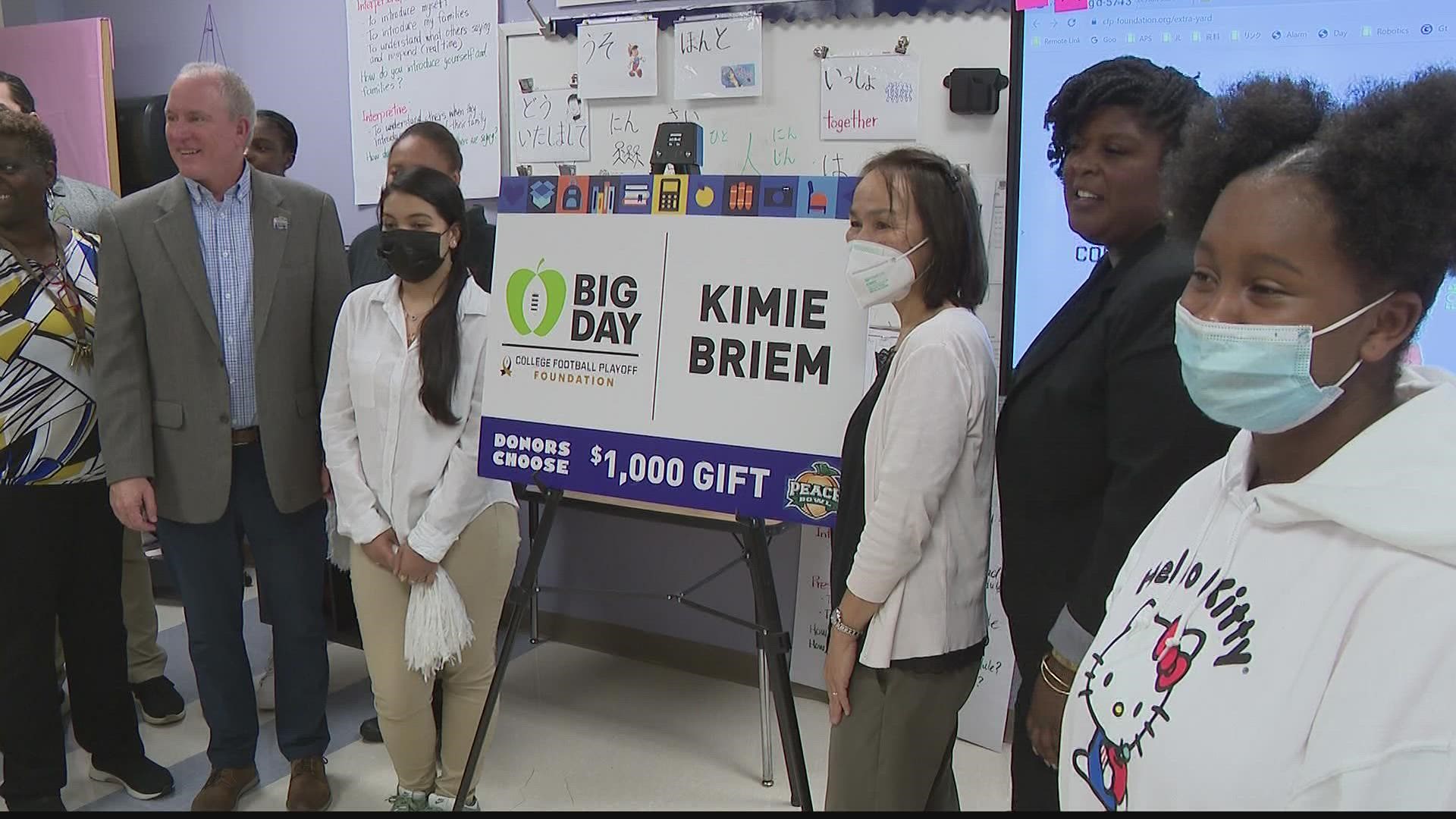 The money will be used to buy the materials needed to help Kimie Briem's students enter their first robotics competition.