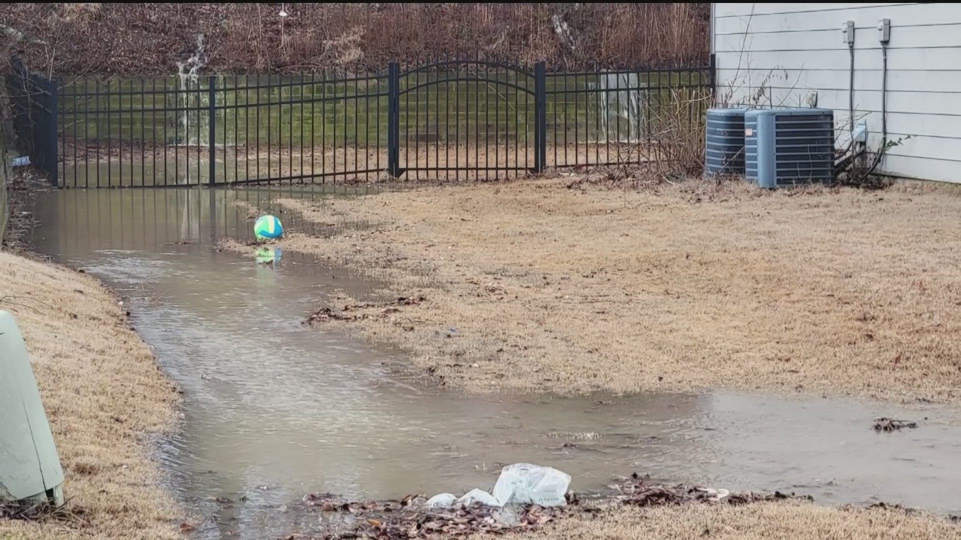 They allege a retention pond built near Northeast Georgia Medical Center is only making it worse.