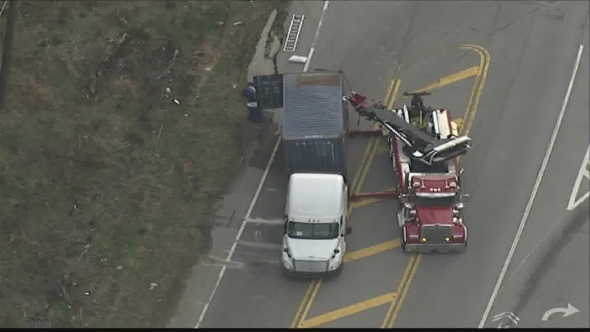 A tractor-trailer flipped over in Douglas County Wednesday afternoon, causing a hazardous spill.