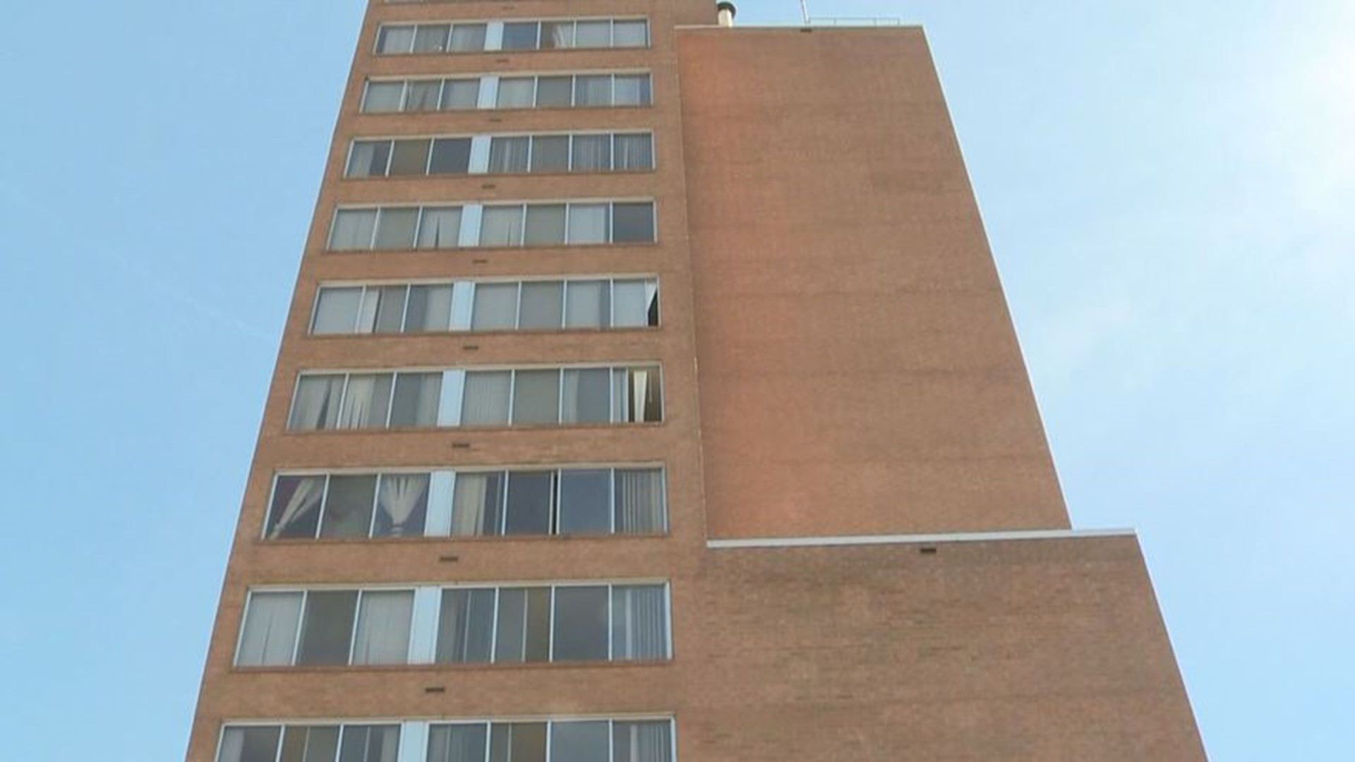Residents at Friendship Towers receive their second air conditioner
