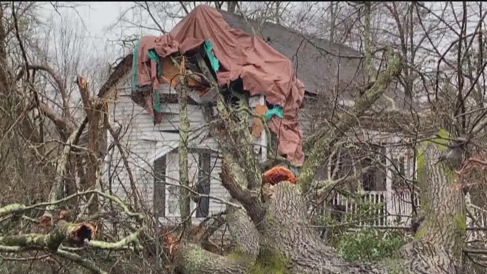 Survivors of the Georgia tornadoes of two weeks ago worked Tuesday to try to protect damaged properties from even more damage in the storms hitting early Wednesday.
