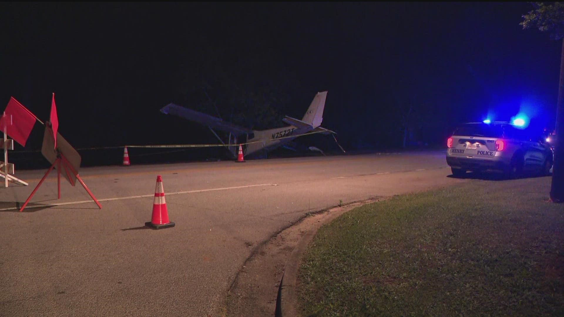 A small plane struck some power lines and ended up on the side of a road Monday evening in Henry County, officials said.