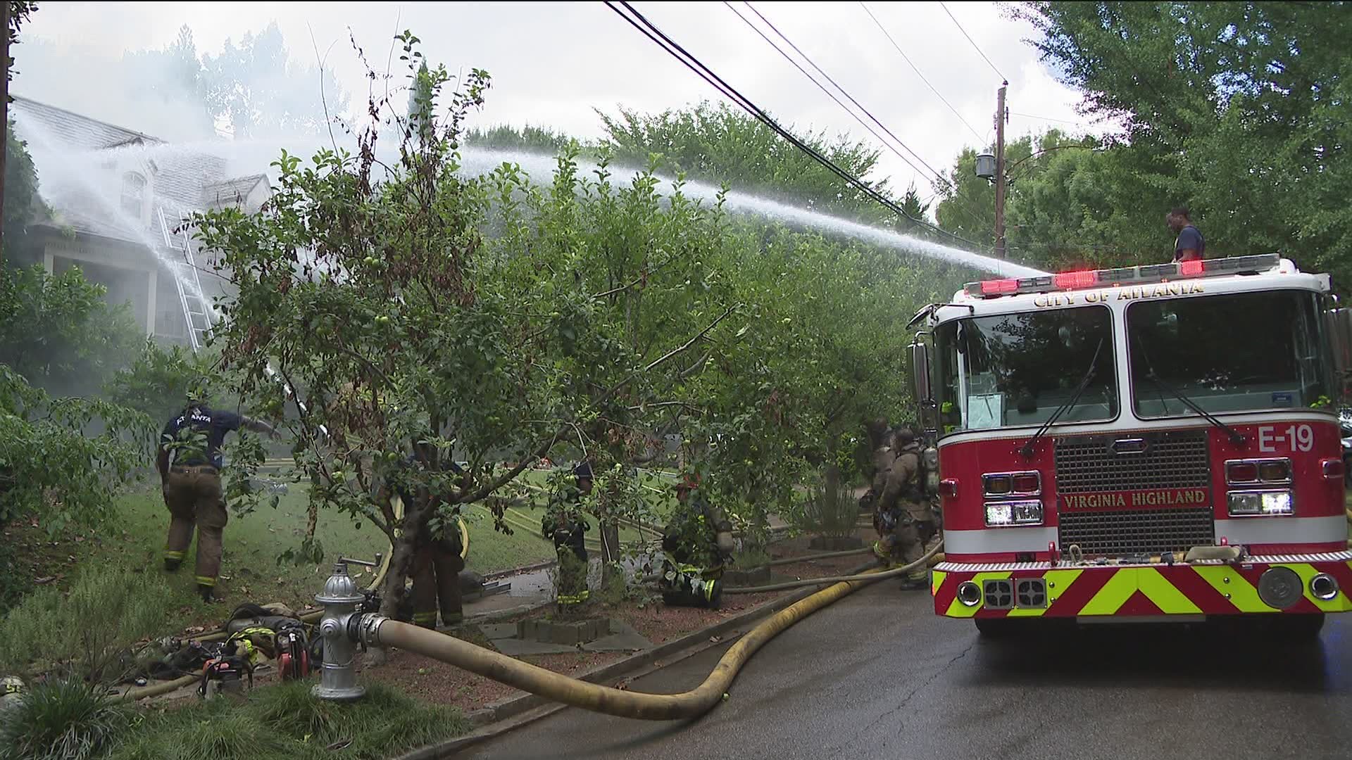 Firefighters were seen dousing the flames coming from a large two-story home off Lanier Boulevard in the Morningside-Lenox Park neighborhood near Virginia-Highland.