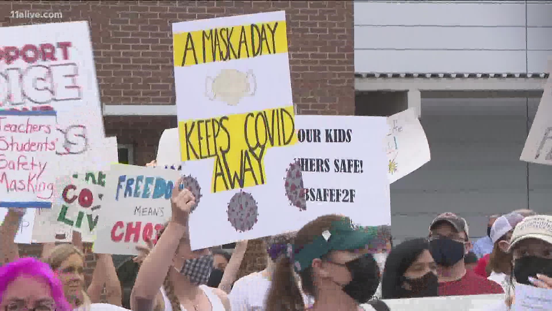 The announcement comes as nearly 200 people were protesting outside of the school district's board meeting for different reasons.