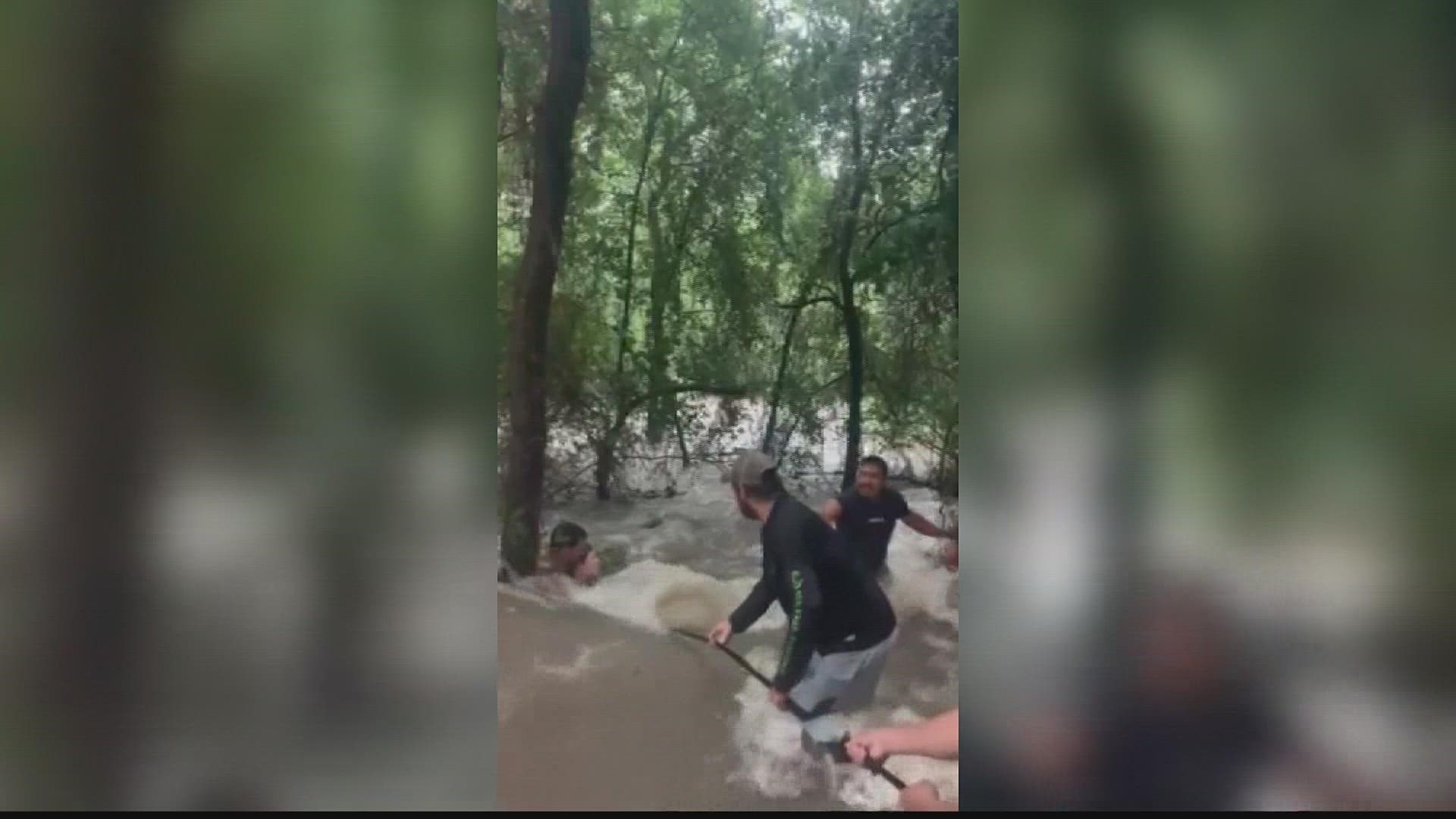 Two children and their father were saved from the rising flood waters.