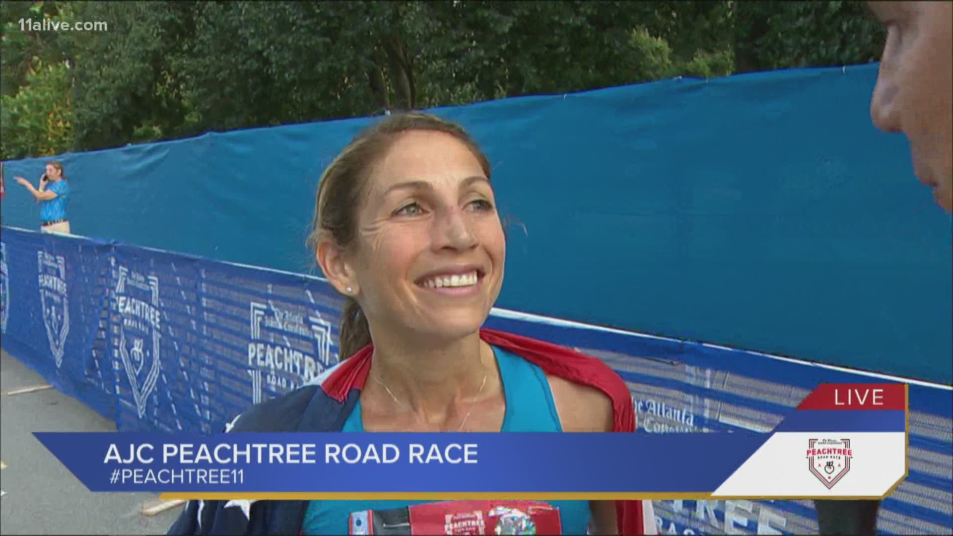 Sara Hall, a perennial American distance running champion, broke away at the end to win the AJC Peachtree Road Race women's race on Sunday.