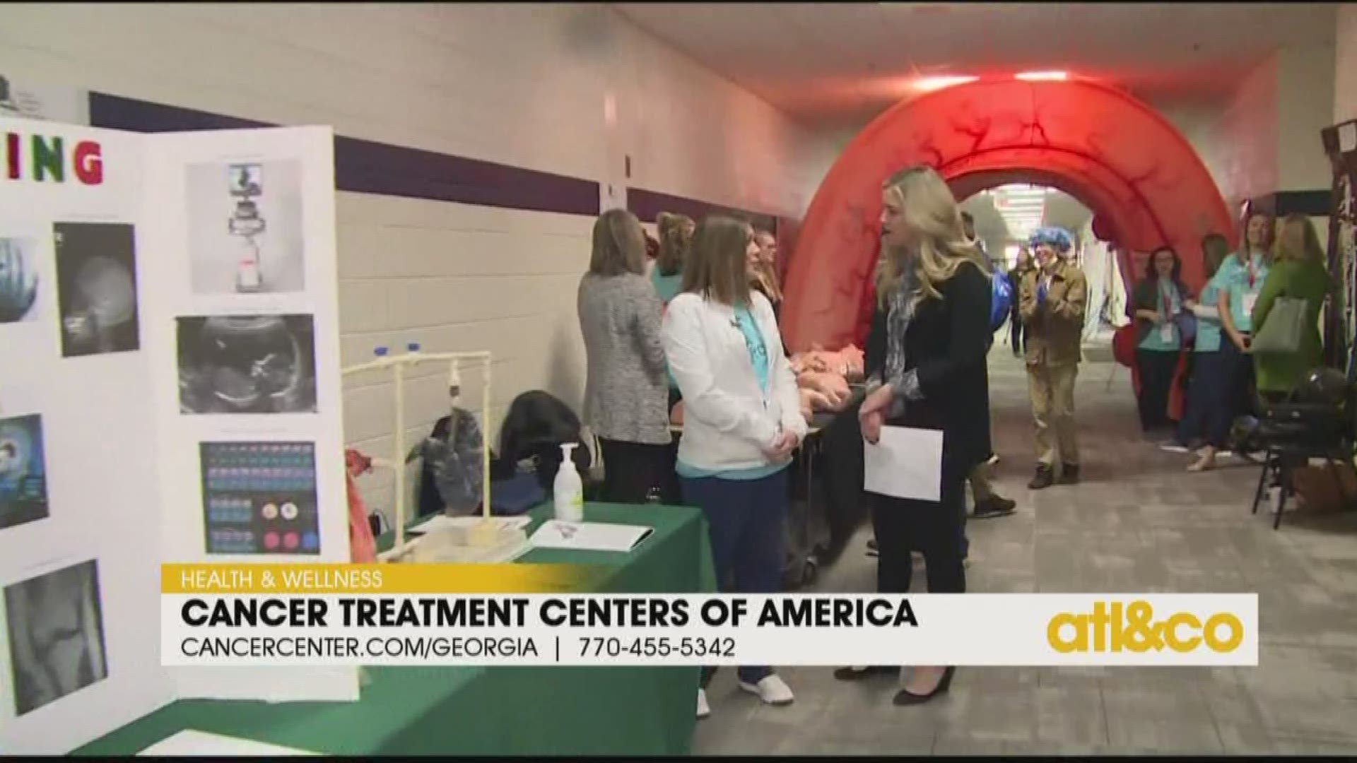 Cara Kneer checks out the Cancer Treatment Centers of America exhibit at Coweta Works.