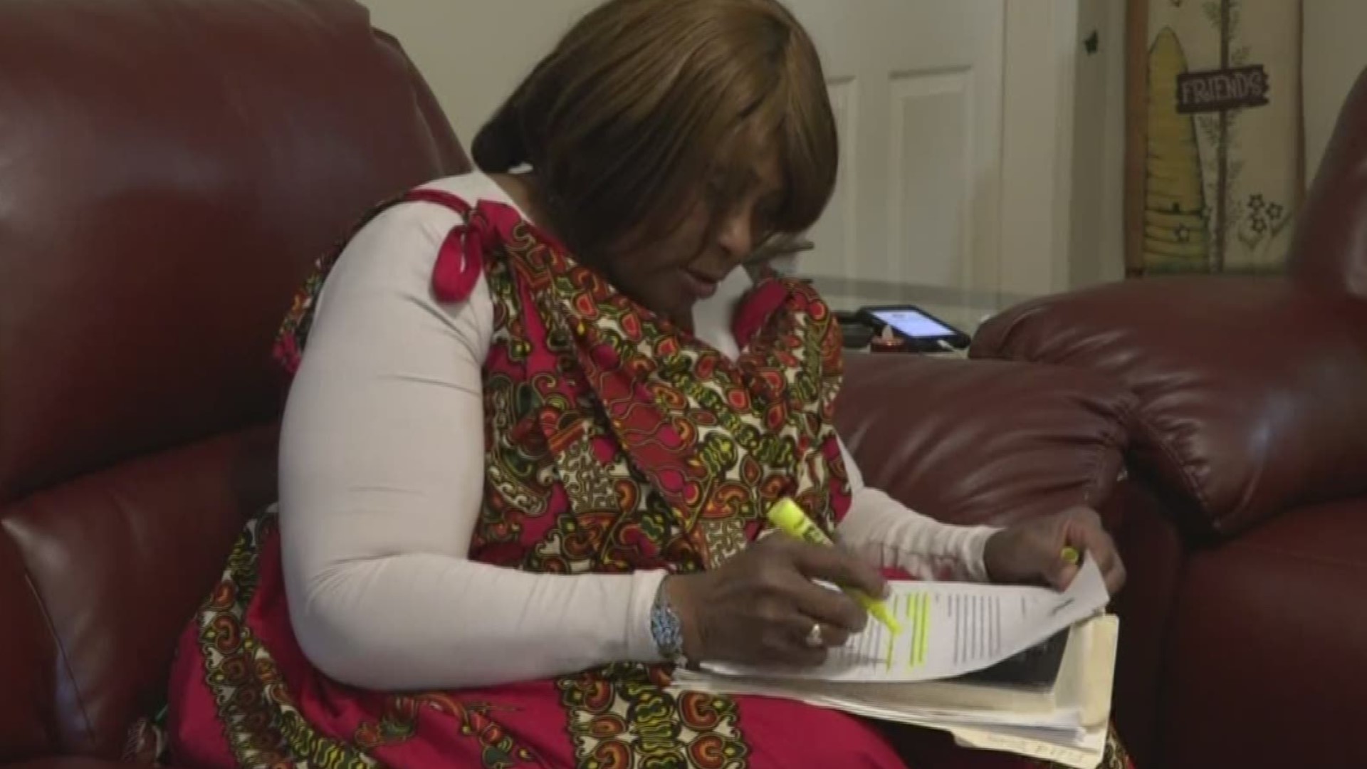 A DeKalb County teacher says two slip and falls on the job put her out of work.