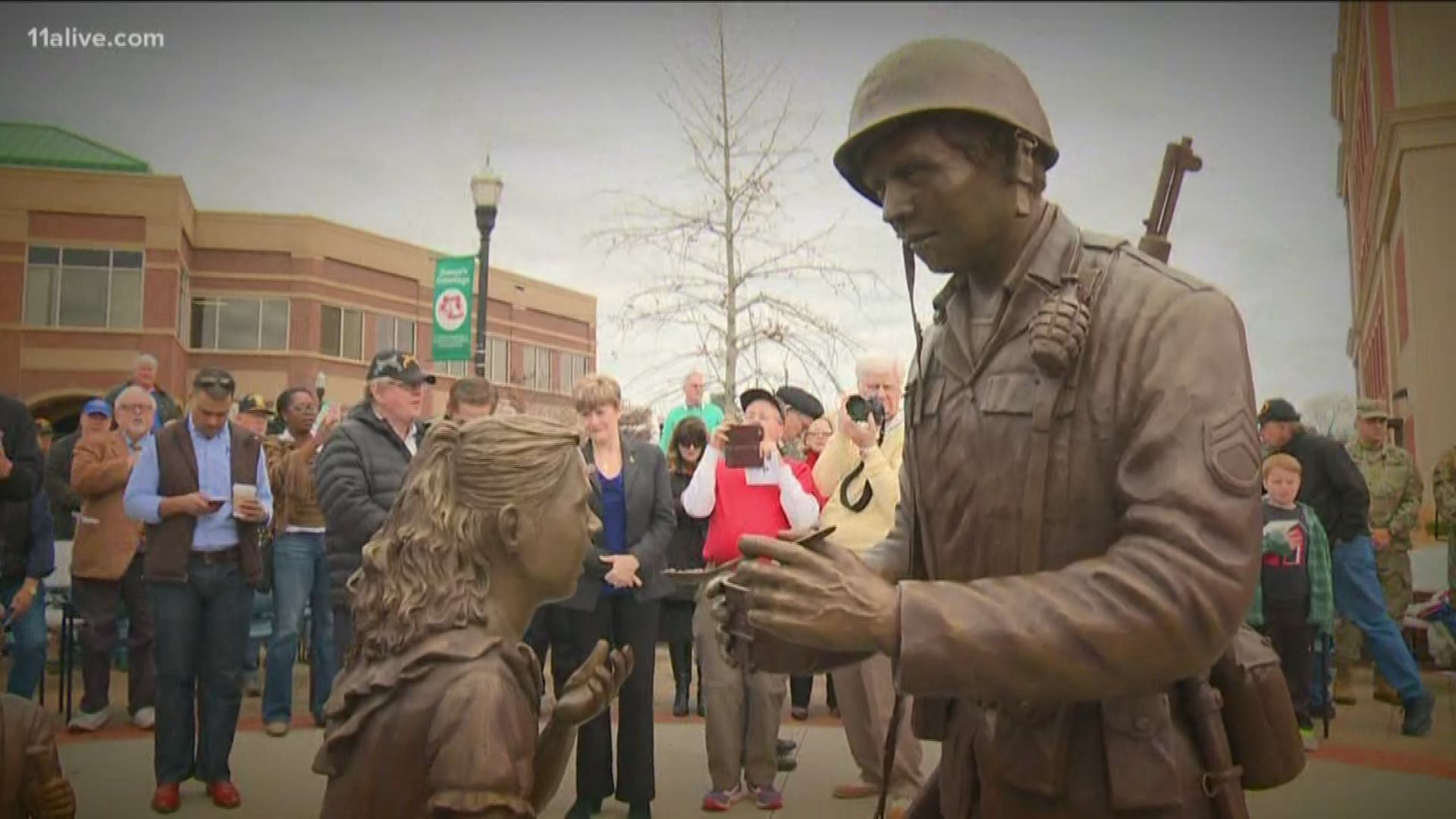 The statue was revealed in front in front of the Cumming Court House. It honored all veterans - especially those from WWII.