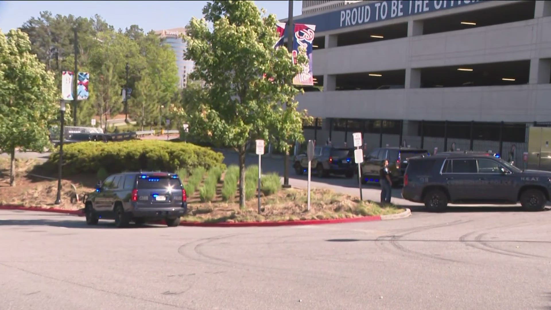 Law enforcement is surrounding the area of the Delta parking lot near Truist Park as the manhunt continues.