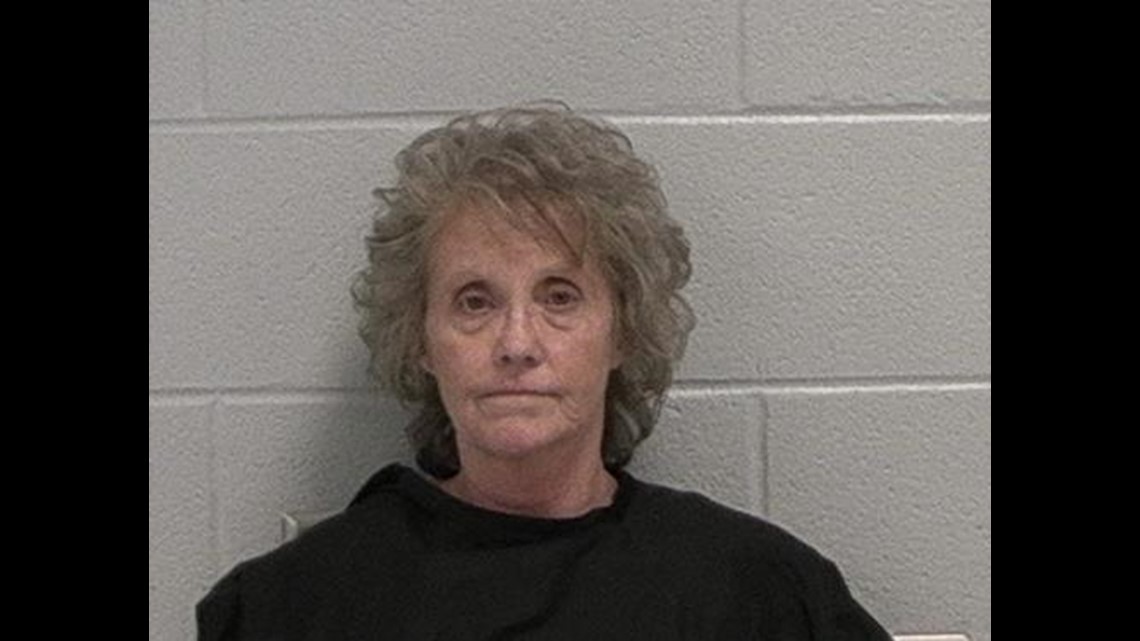 Woman charged with stealing flowers from graves