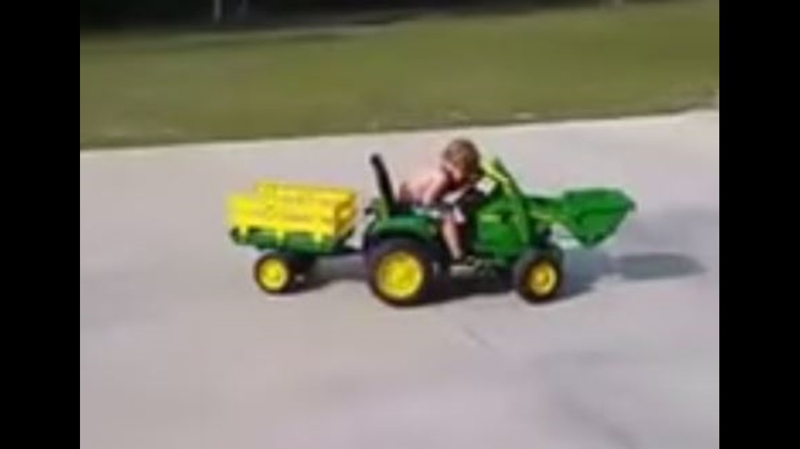 WATCH Boy falls asleep at wheel of toy tractor(01)