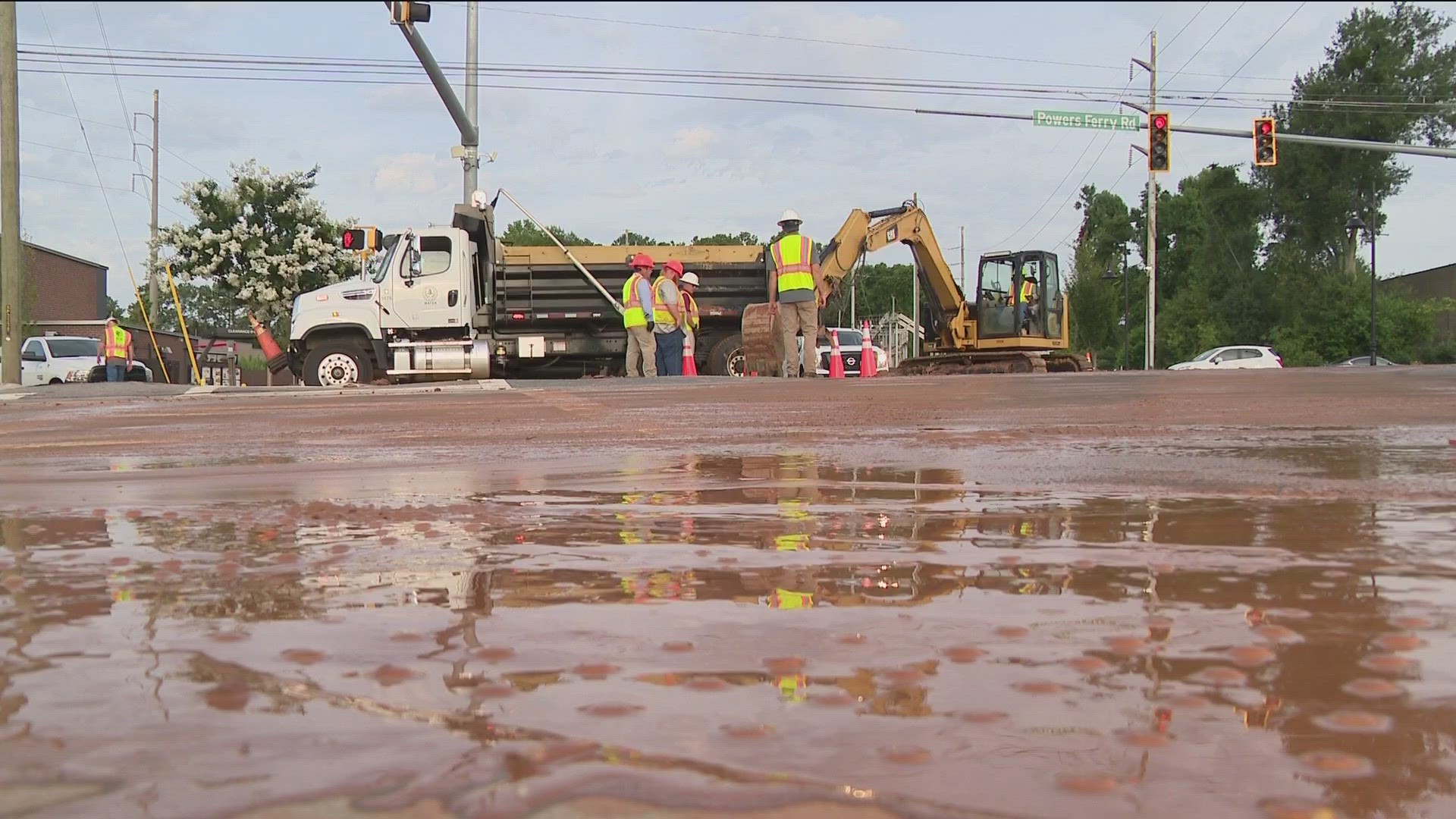 A release states that Powers Ferry Road between Delk and Terrell Mill Roads is closed due to the break.