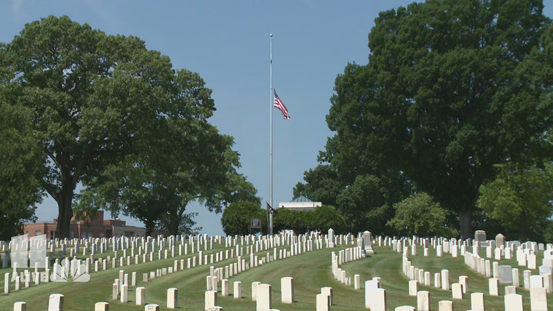 Despite coronavirus restrictions, some graves at Marietta National Cemetery get flags placed ahead of Memorial Day.