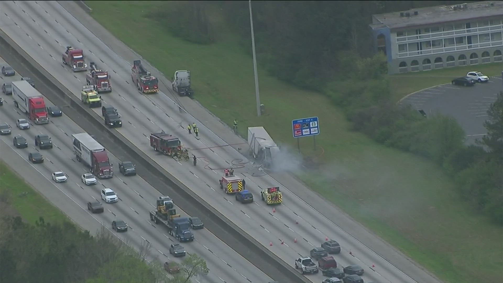 All lanes are blocked on I -285 South down near the airport with two tractor-trailer fires causing a full shutdown.