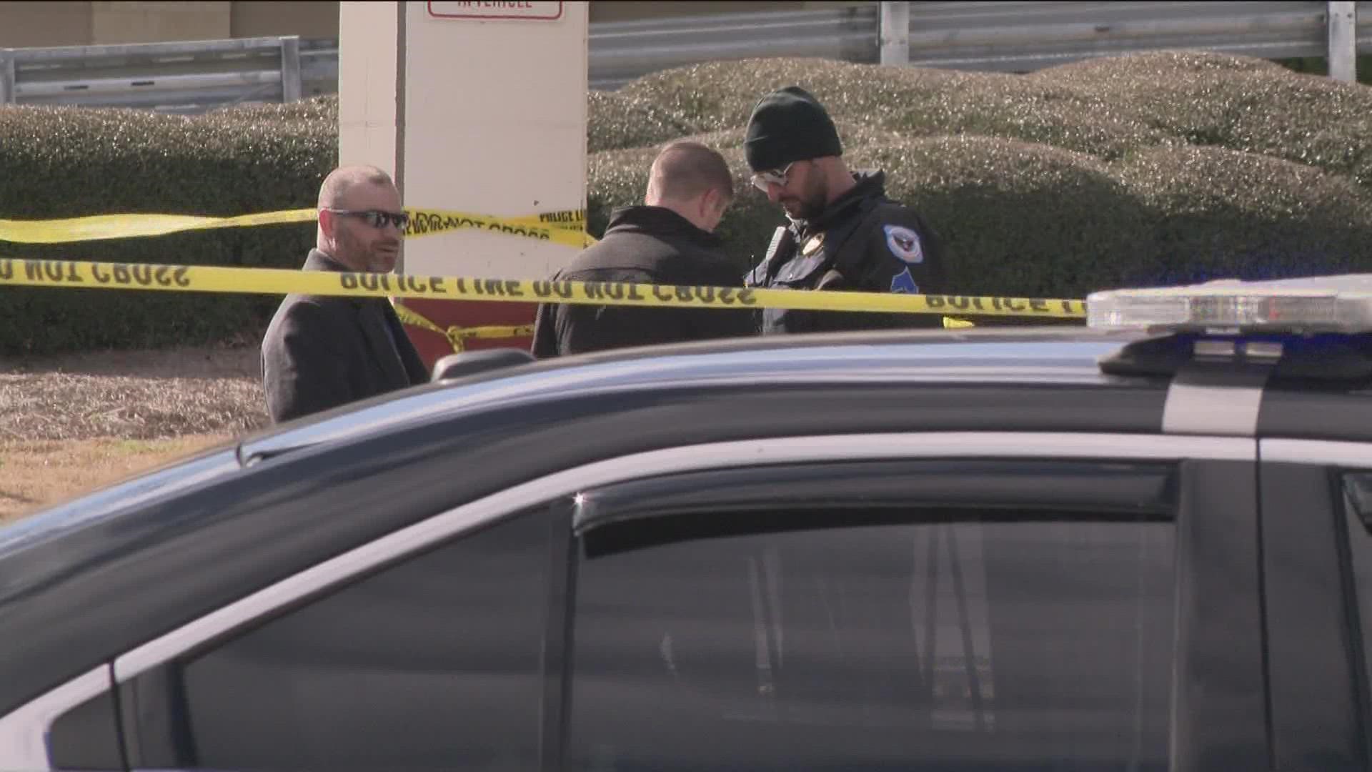 Cobb County Police responded to the scene at 3101 Cobb Parkway, where they located a person shot in the garage behind a Taco Mac restaurant.