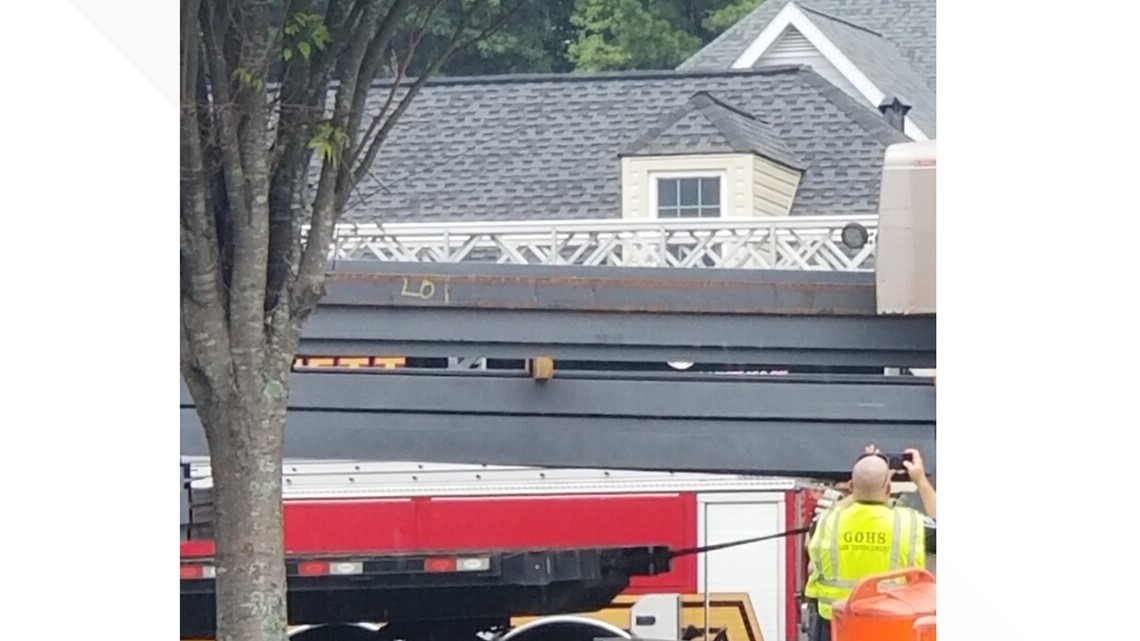 Steel beams crash through truck's cab, killing driver