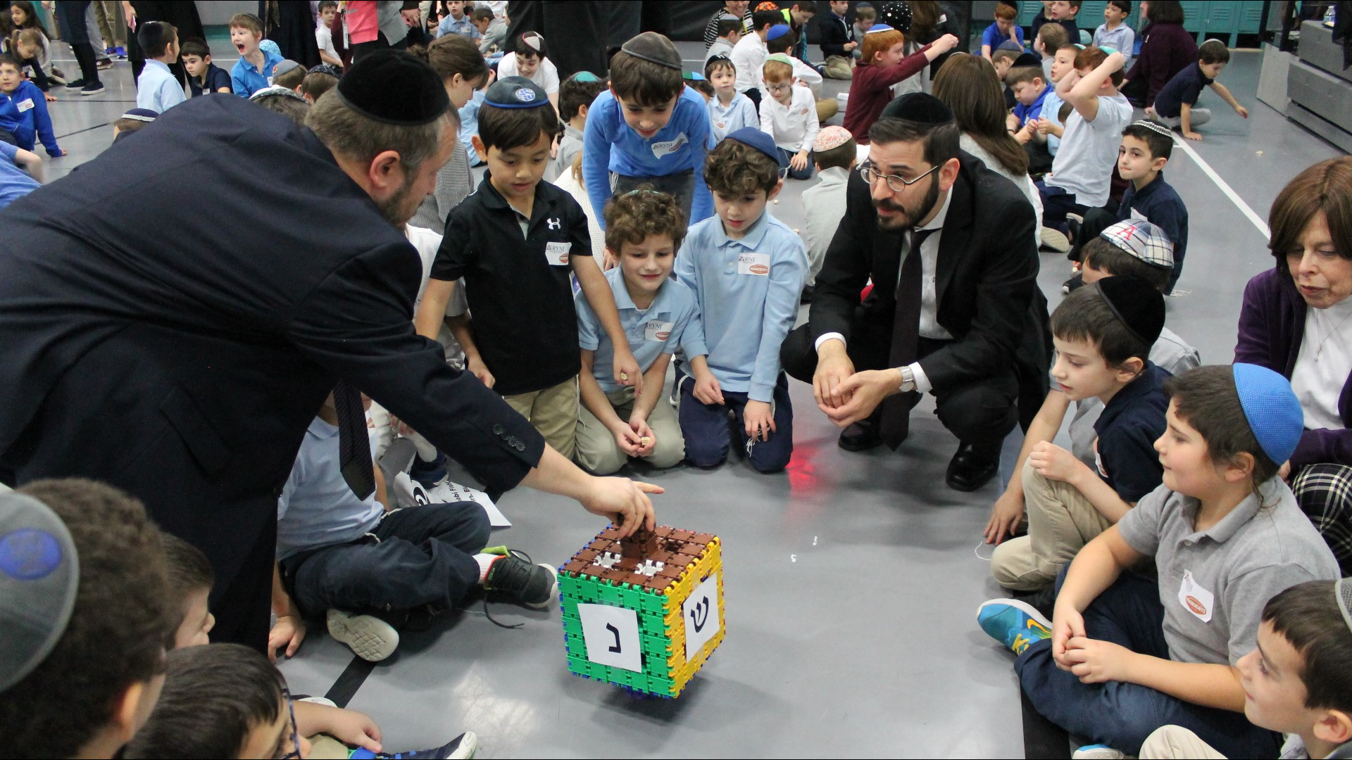 The company partnered with students and staff of the Rosenbaum Yeshiva of north New Jersey to spin a world record 1,369 dreidels at the same time!