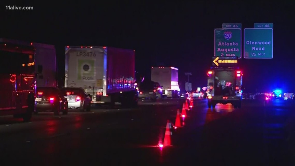 Several lanes shutdown after car slides under tractor trailer between Covington Hwy and Glenwood