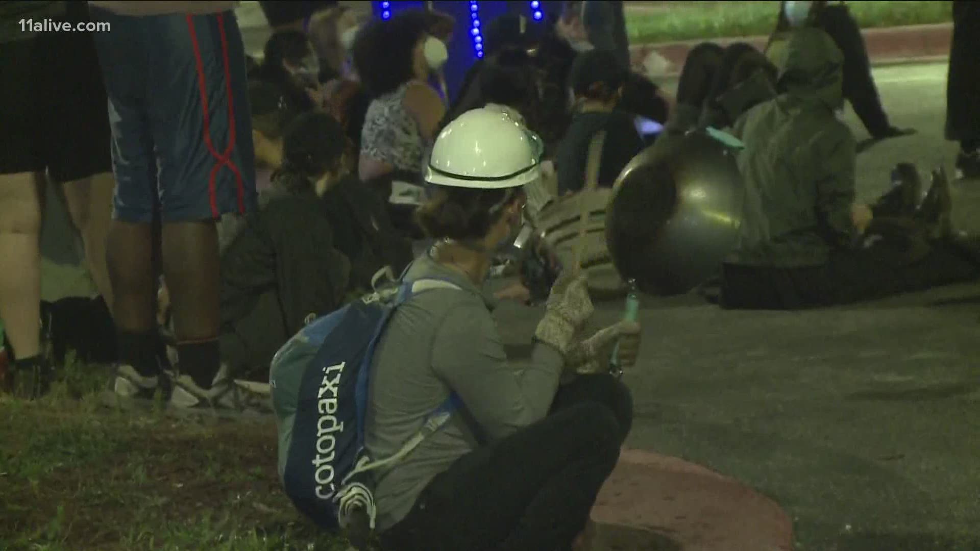 People stood outside the Fulton County jail Tuesday.