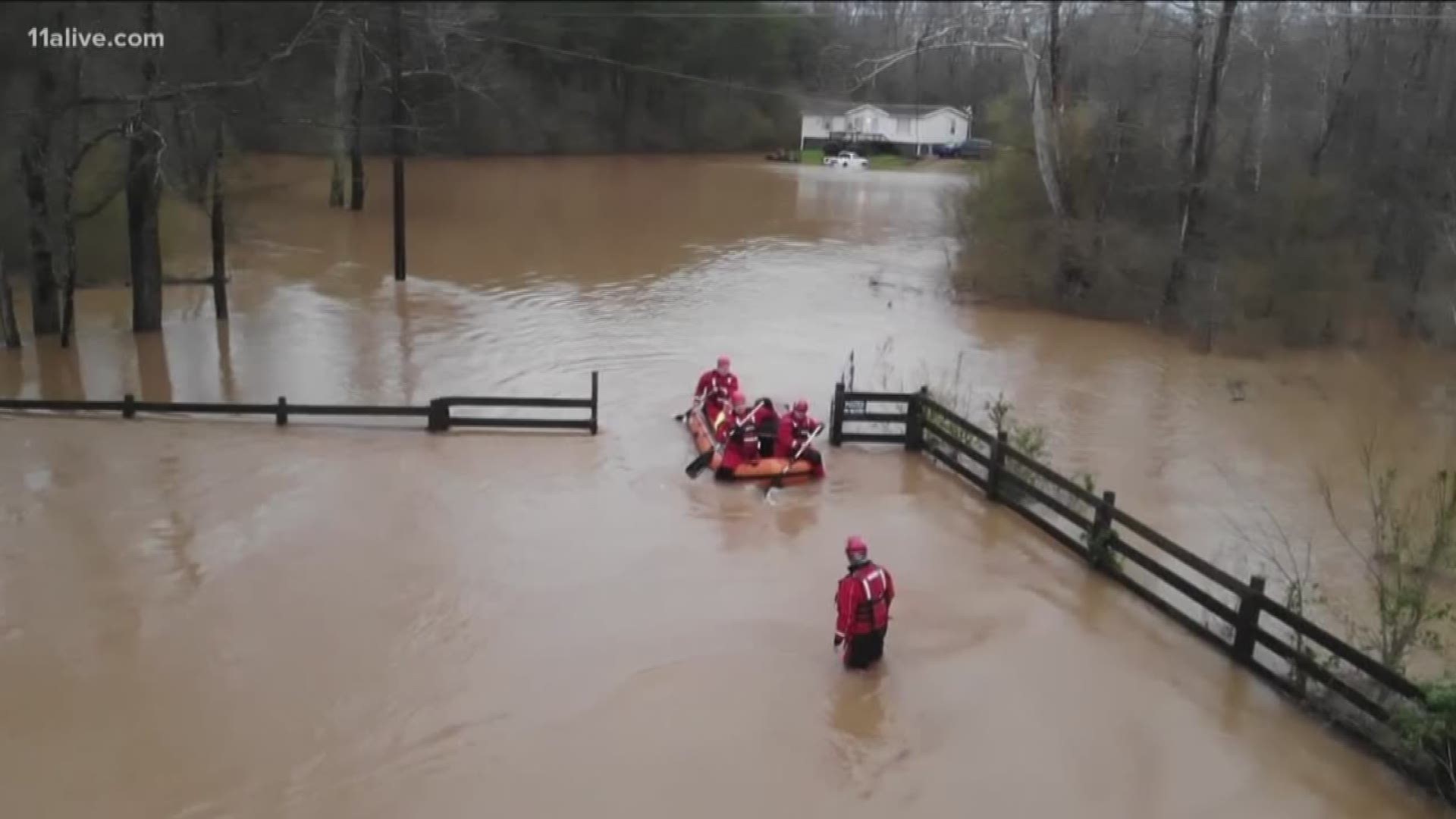 The latest video from neighboring states shows large structures being toppled and large swaths of land completely inundated with water.