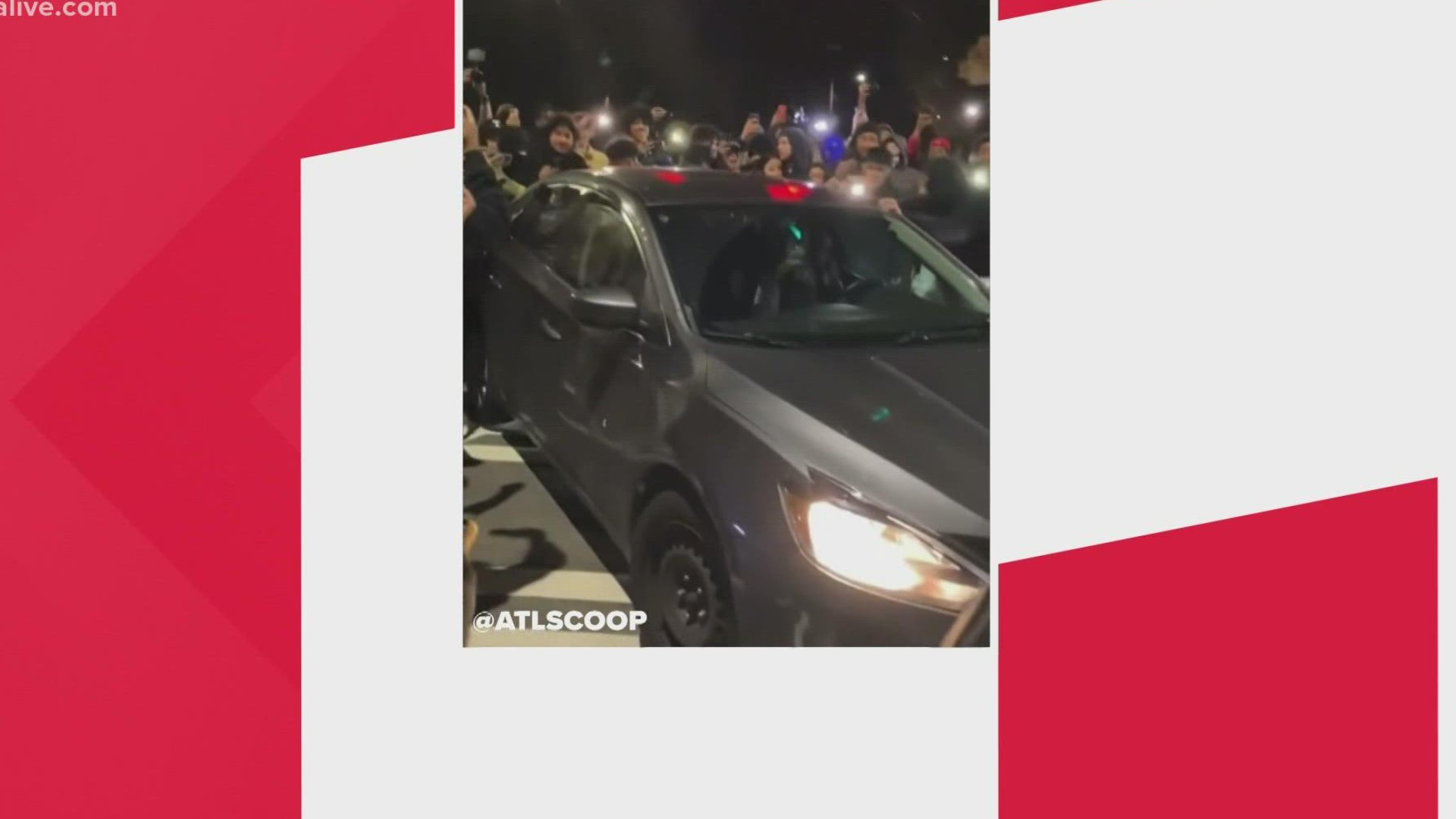 A woman tried to make her way through the intersection during a car meet-up but ended up getting her window smashed.