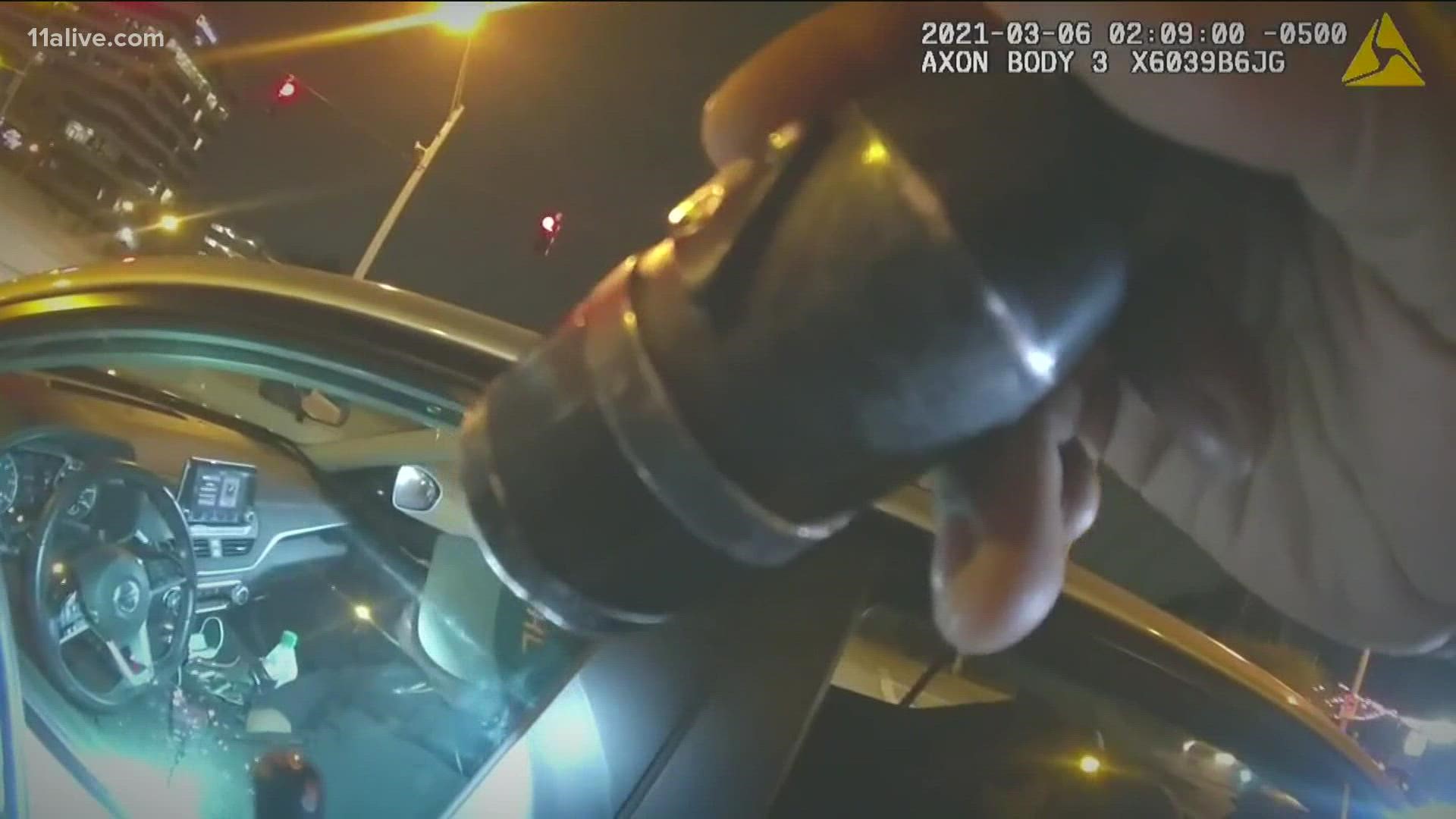 The video also shows the officer's possible split-second decision when the driver reached over to the passenger seat.