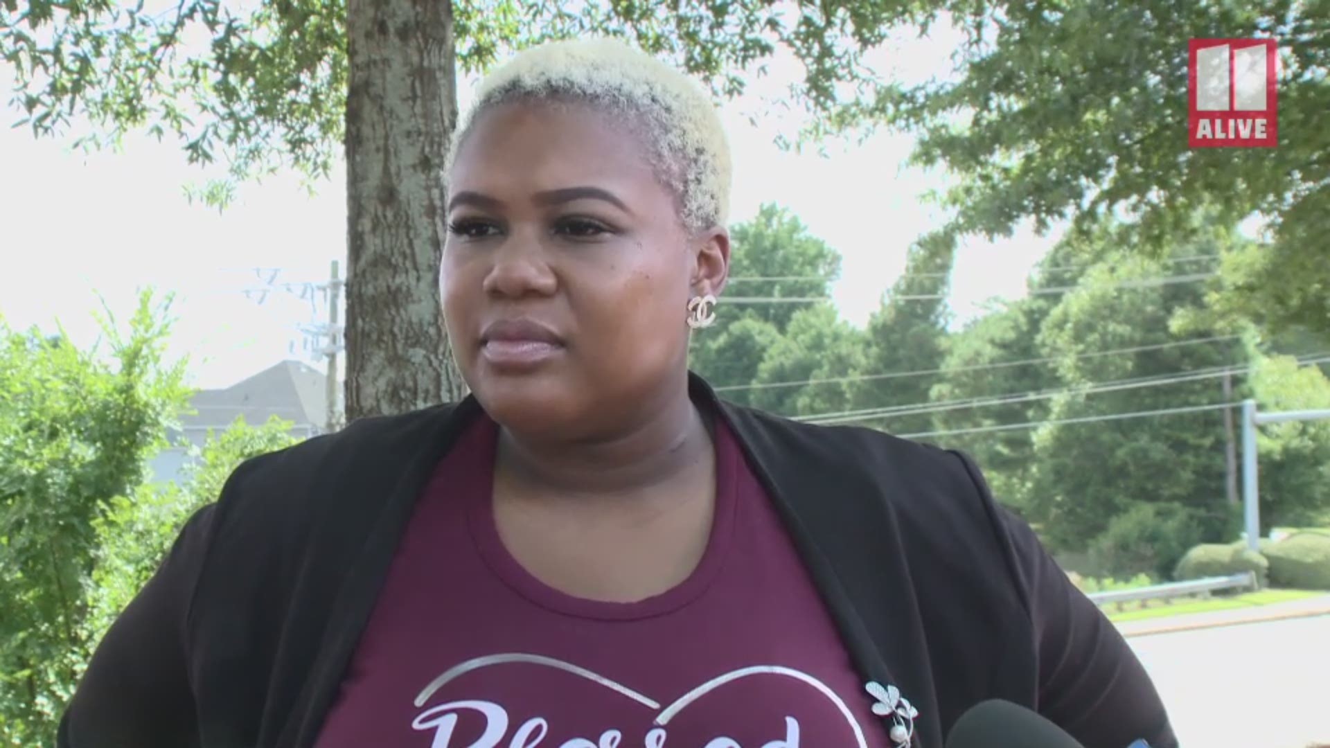 The state representative spoke to media after hearing the public statement of the man she previously accused of telling her to "go back" where she came back from.