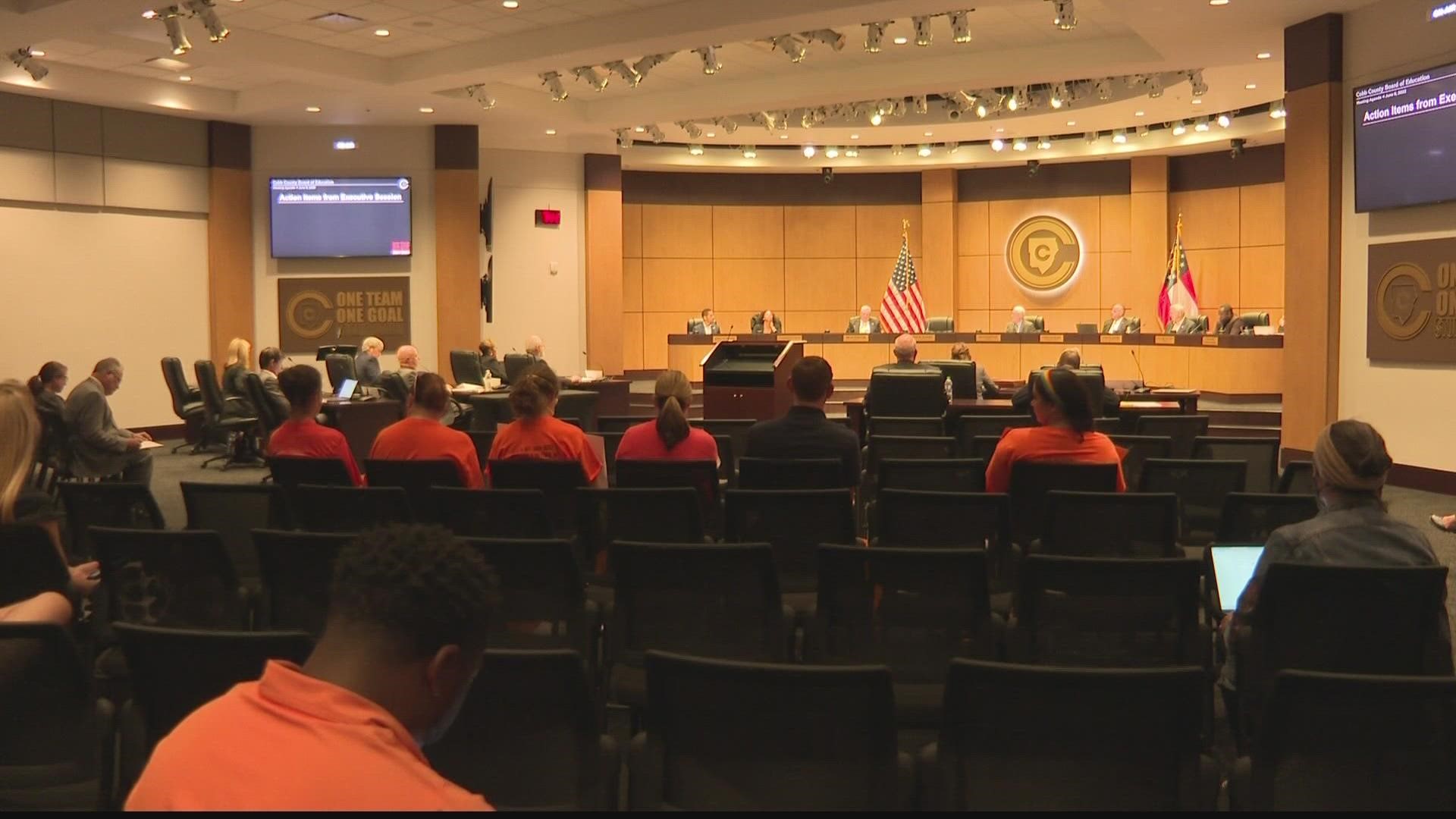 More than a dozen parents gathered outside of the school district headquarters asking for the district to invest in mental health and more safety measures.