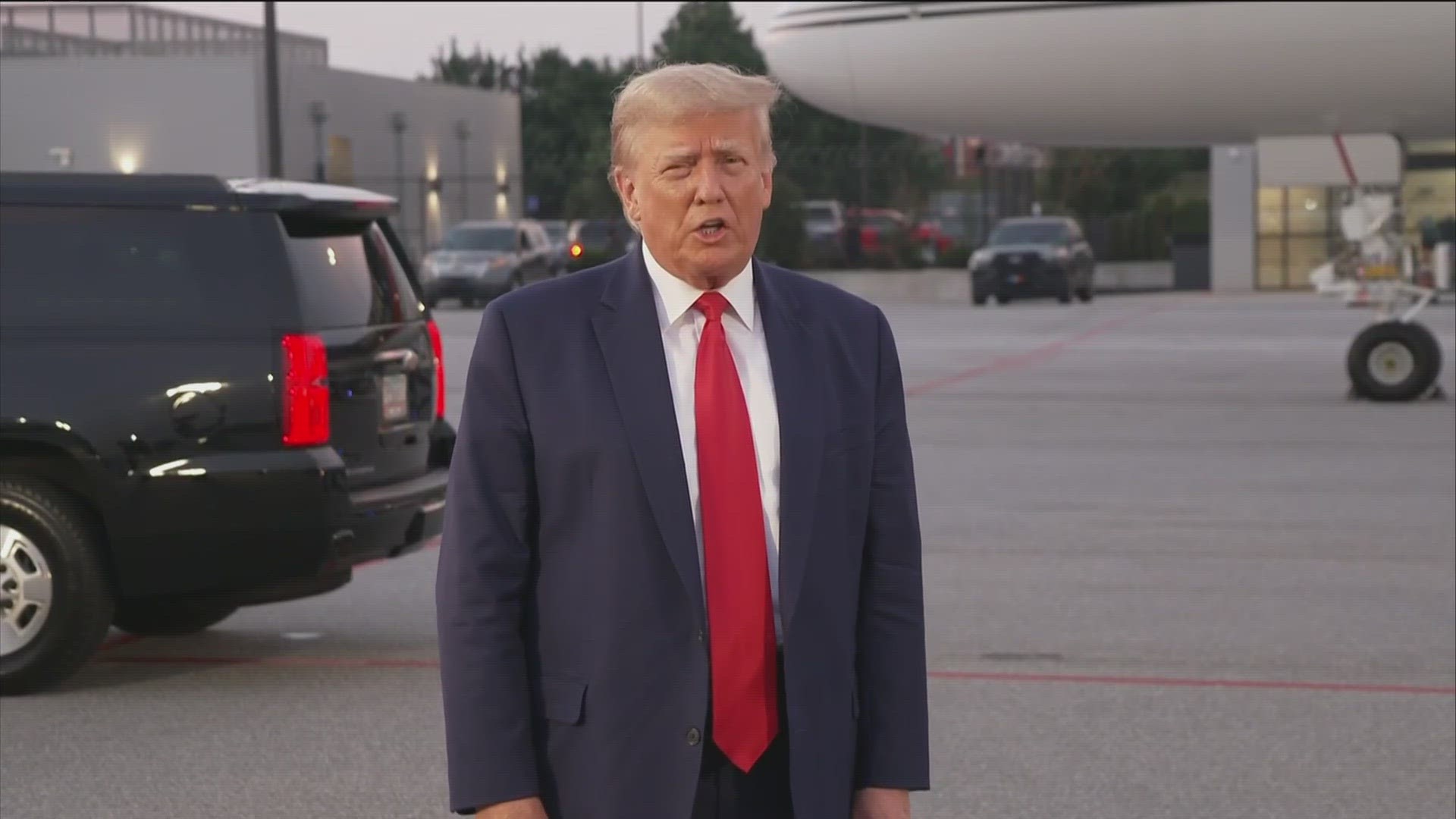 Former President Trump's motorcade returned to Hartsfield-Jackson airport after he was booked in Fulton County Jail. He spoke to the press before boarding his plane.